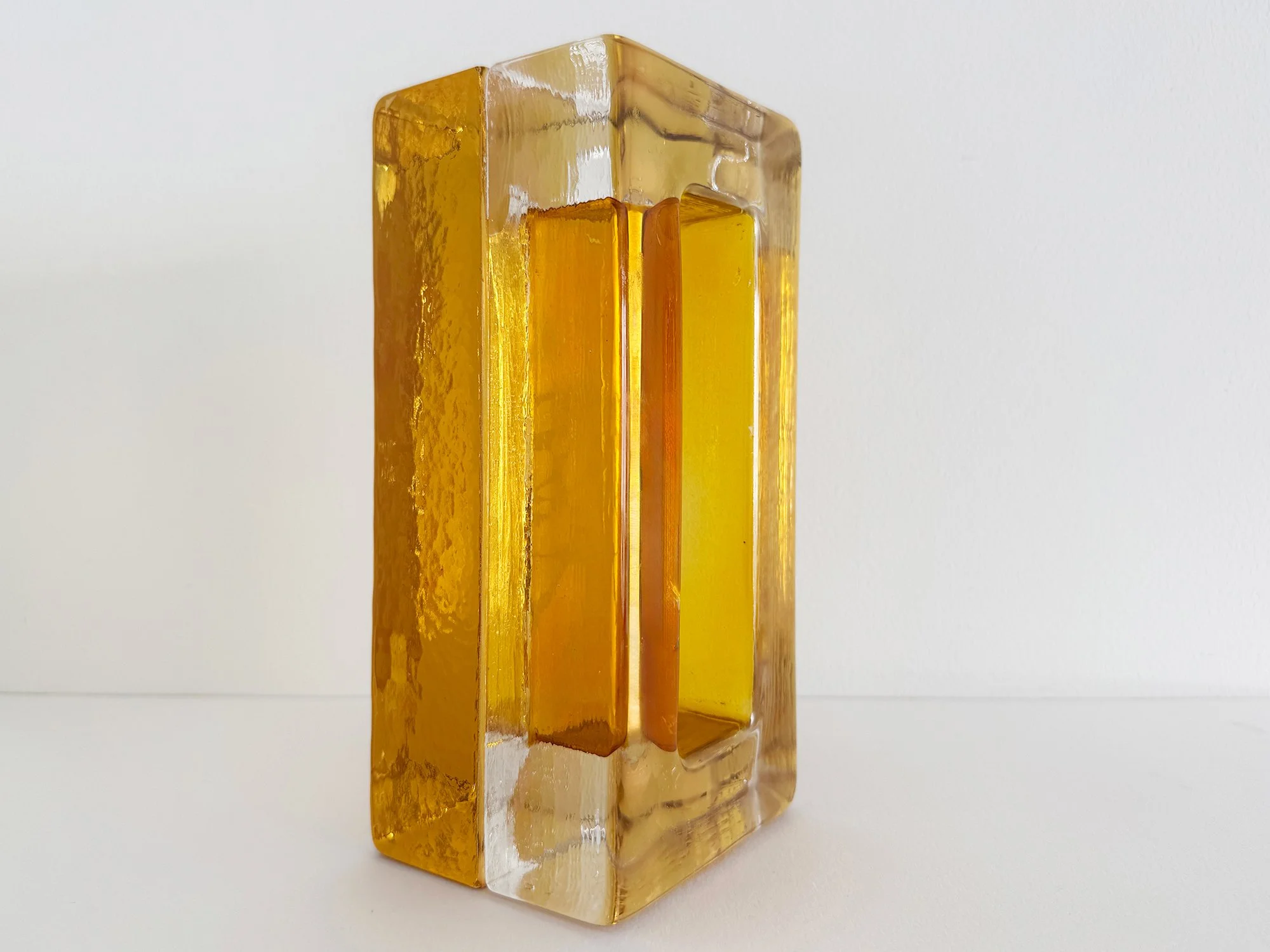 Modern collectible glass sculpture with rectangular form and internal spatial structure