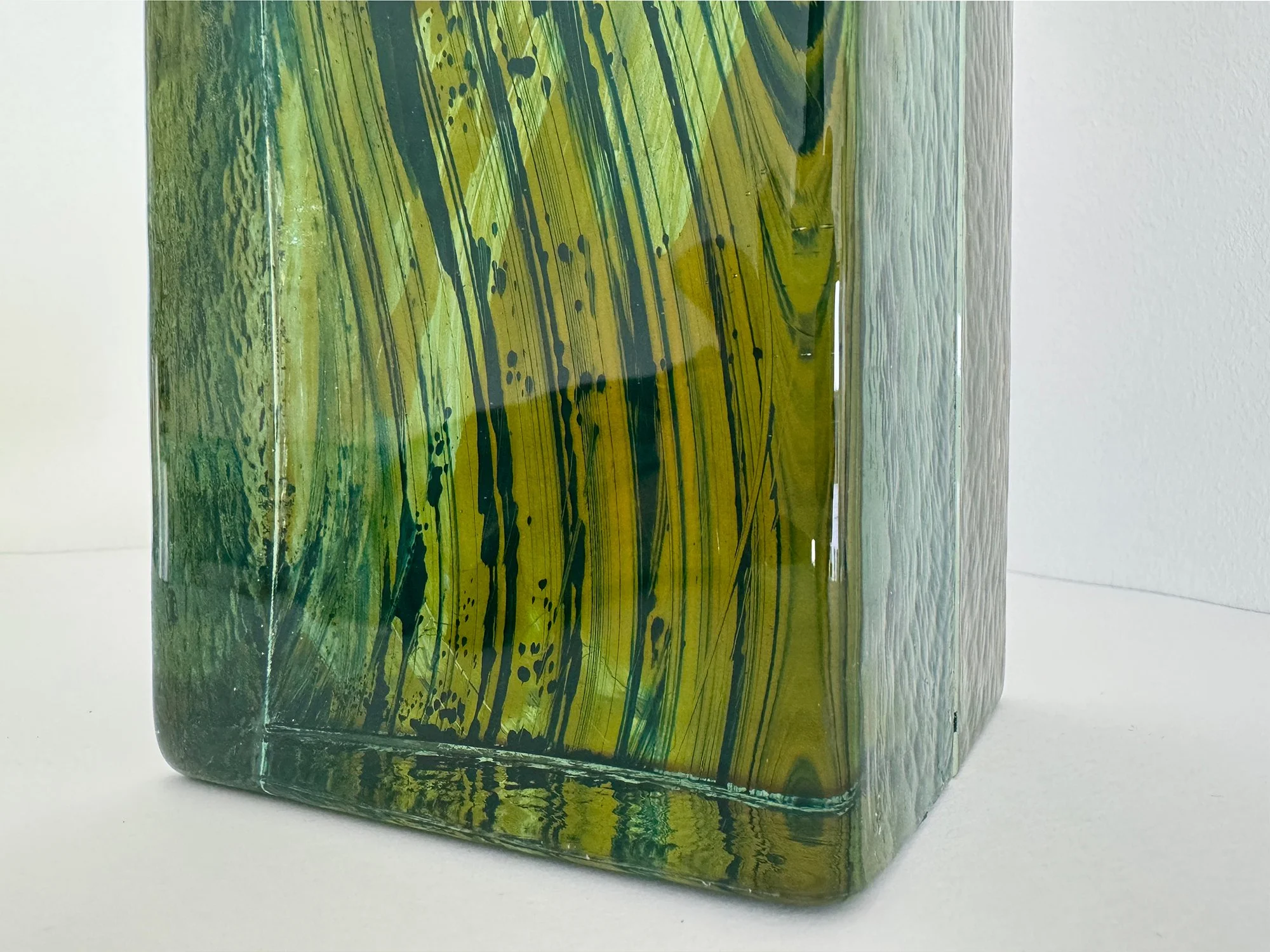 Detail of coloured glass sculpture by Lisette Schumacher showing transparent layers and depth