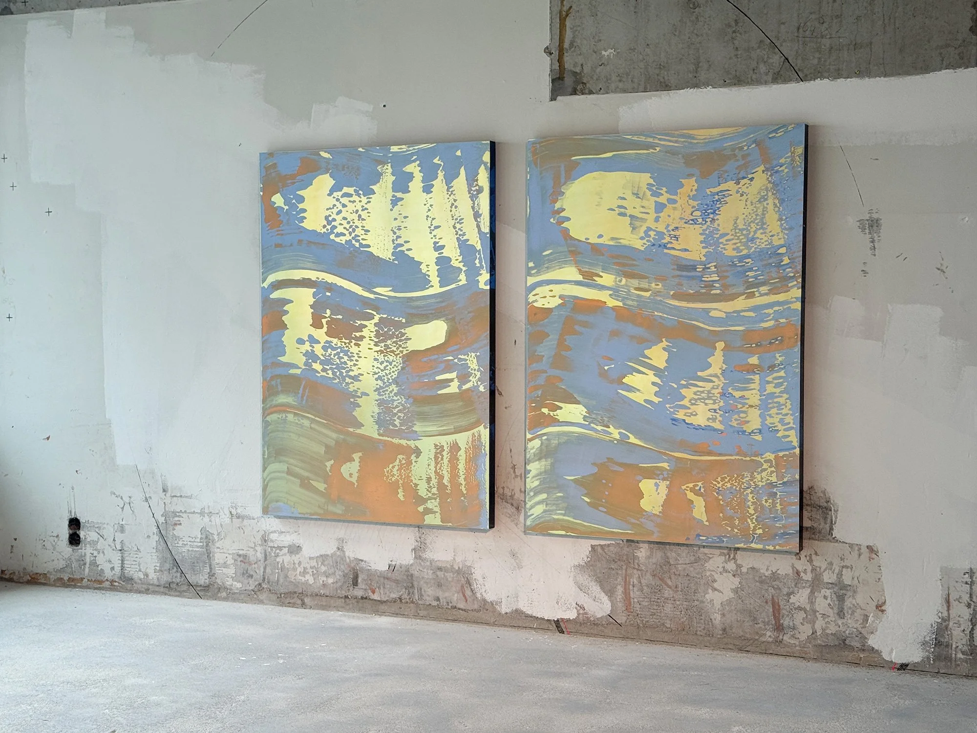 Contemporary abstract paintings by Lisette Schumacher installed together in an industrial interior, highlighting the dialogue between colour, architecture and space.