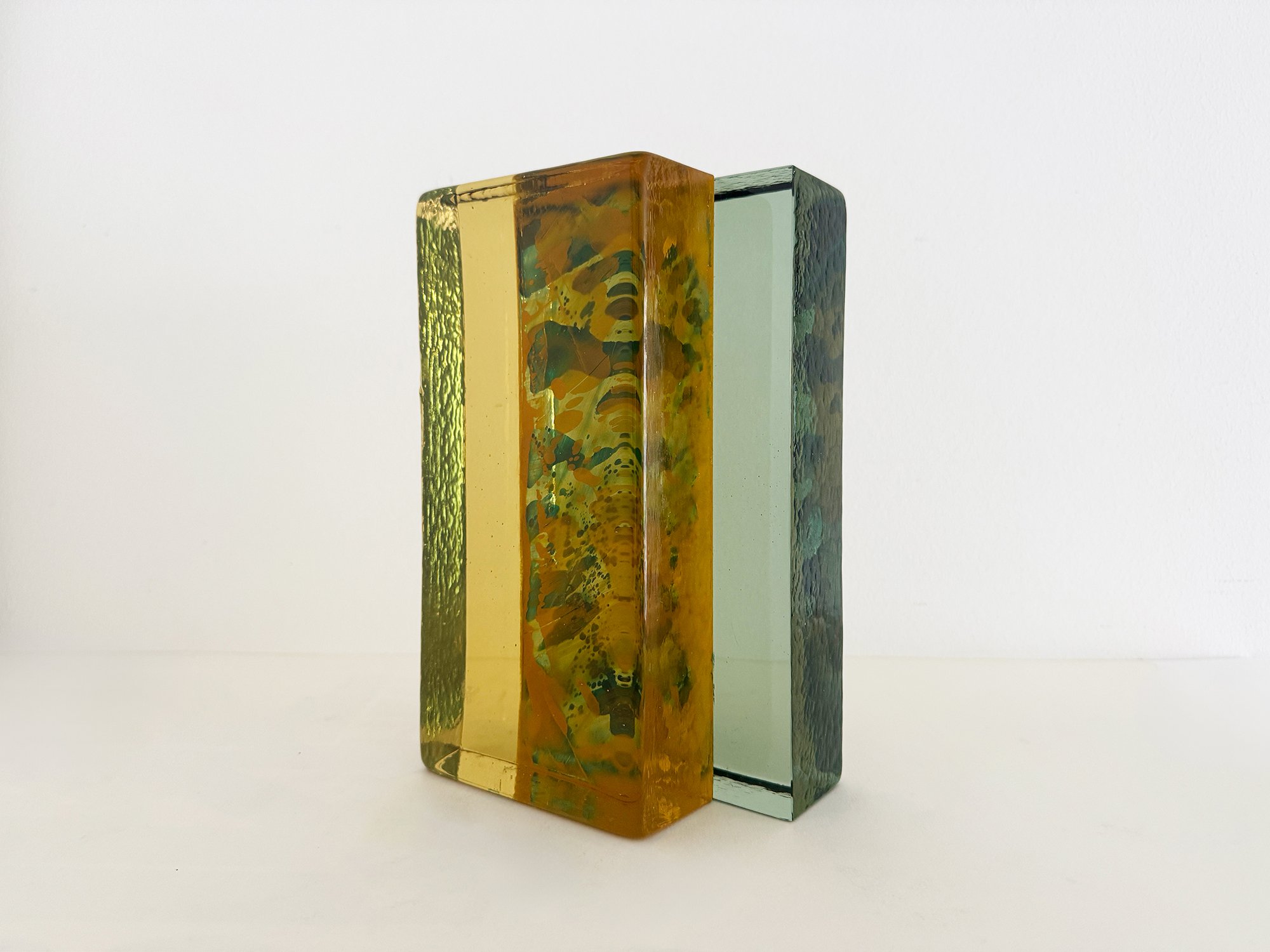 Side view of Spatial Shade IX glass sculpture by Lisette Schumacher showing layered coloured glass and architectural structure