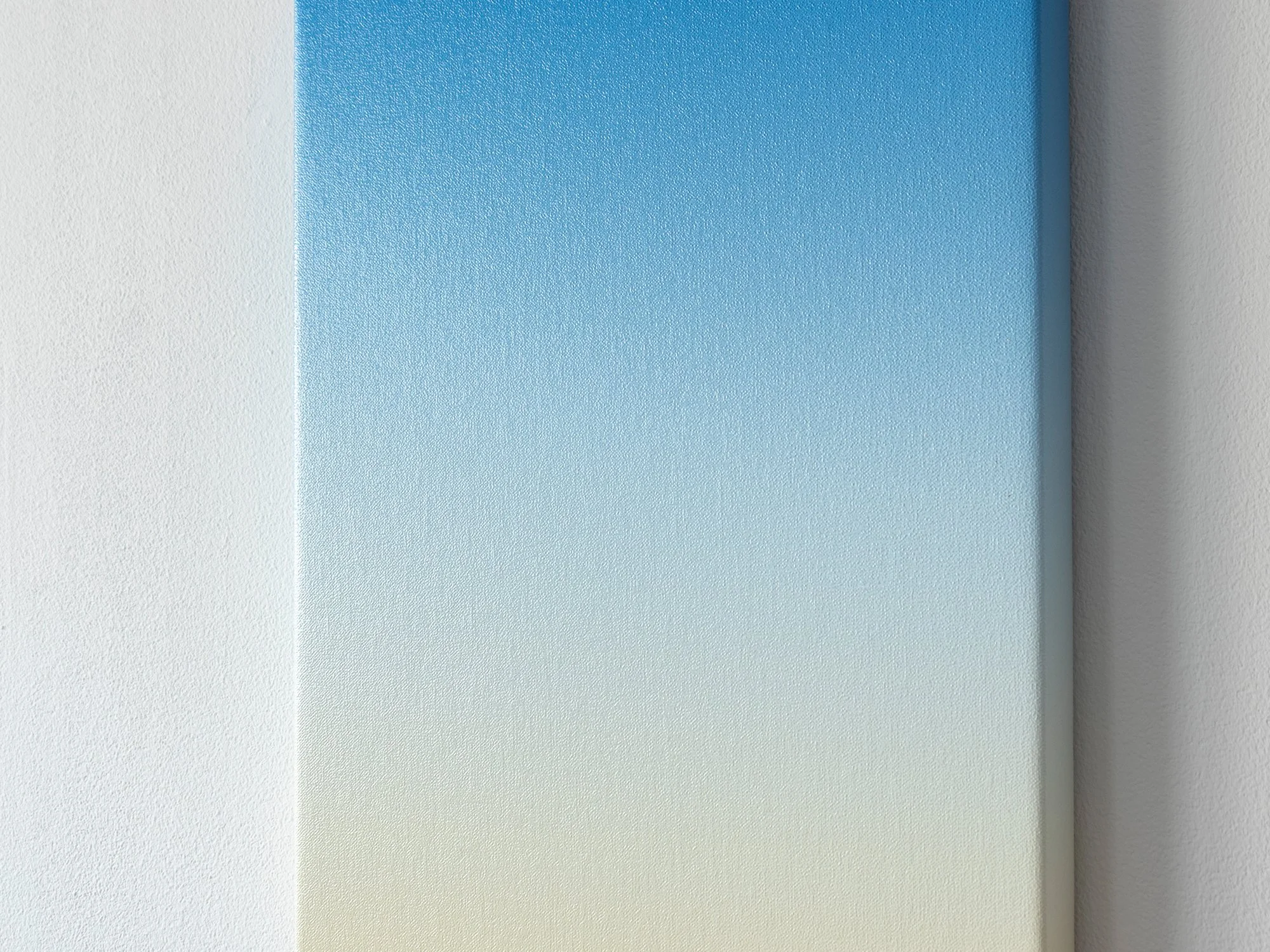 Detail of Cobalt Light by Donald Schenkel, highlighting the subtle oil paint gradient and fine linen texture from pale blue to warm sand hues.