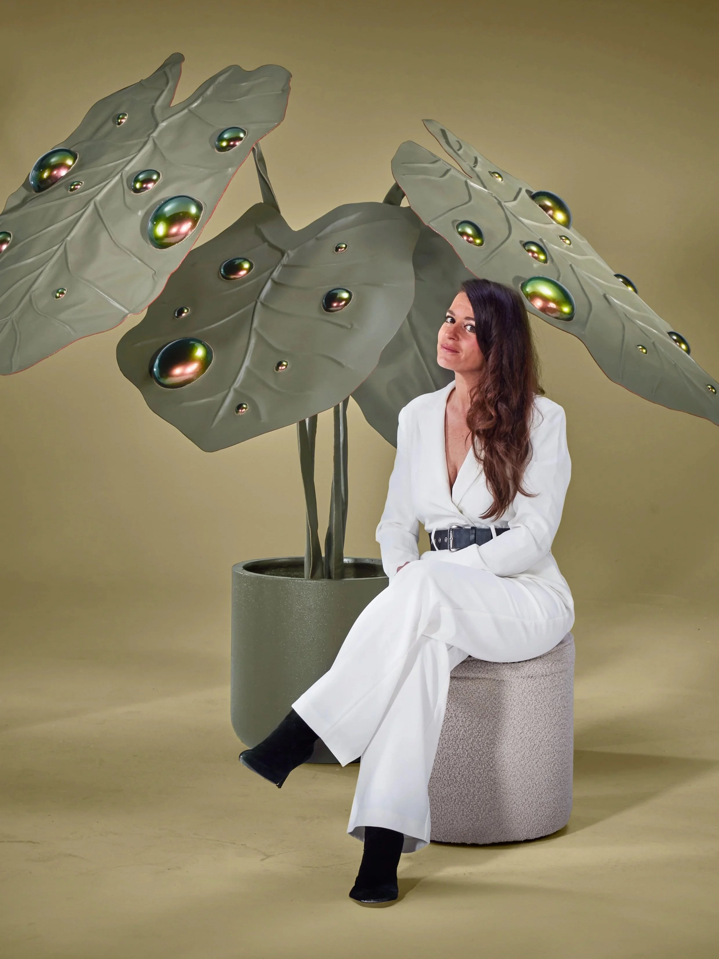 Dutch artist Madelon Uljee with a large-scale leather installation from the Architectural Flora series, inspired by tropical leaves and organic patterns.