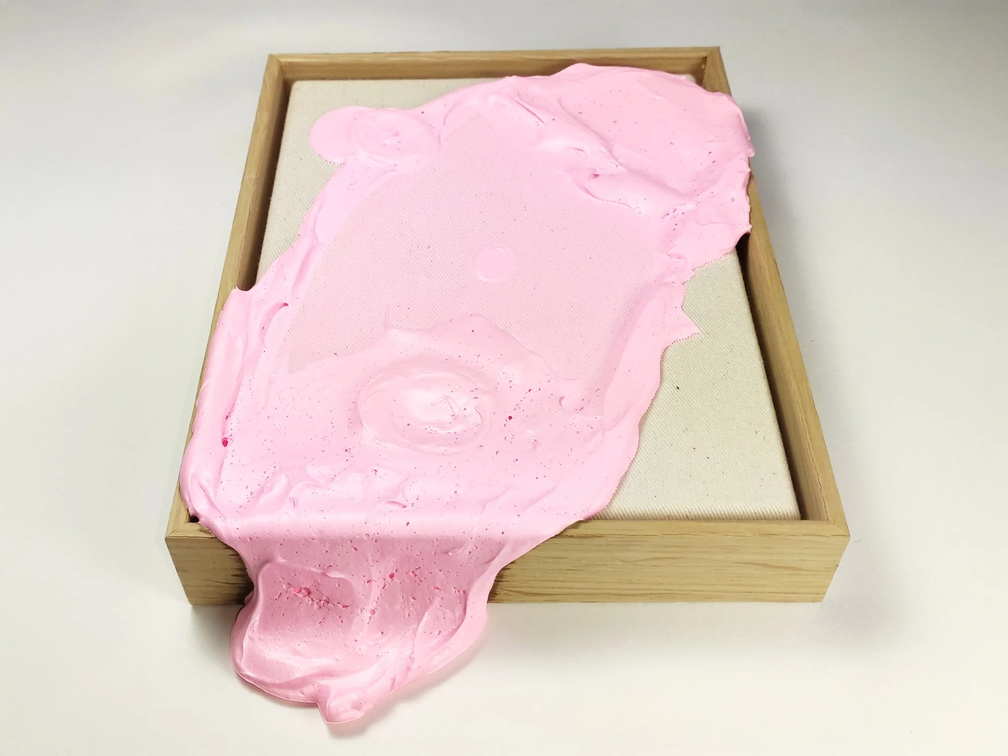 Detail of the powder pink paint, floating over the frame. A piece by Karen van de Vliet.