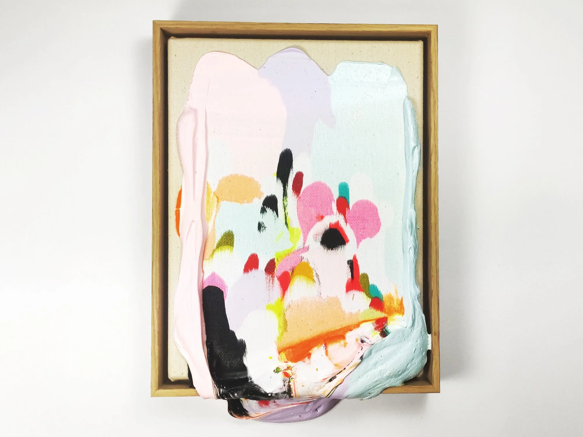 Front view of Karen van de Vliet’s Poppie 3, a small sculptural painting with layered pink, neon and pastel colours.
