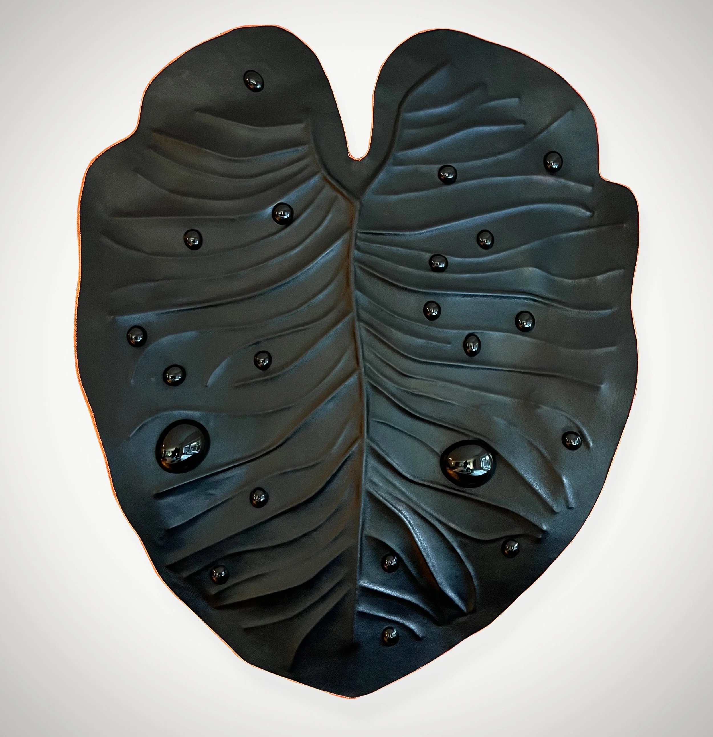 Large-scale, black sculpture by Madelon Uljee, designed to interact with architectural space