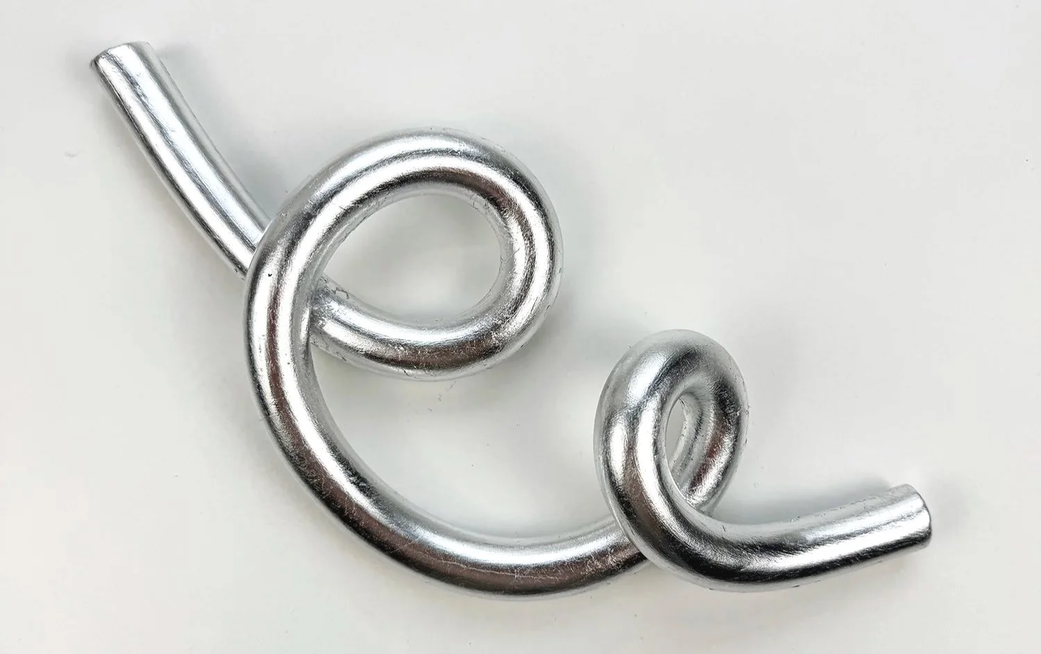 Handcrafted silver-coloured clay wall sculpture by Dutch artist Sina Steiner, part of the Becomings series, exhibited at Root Gallery.