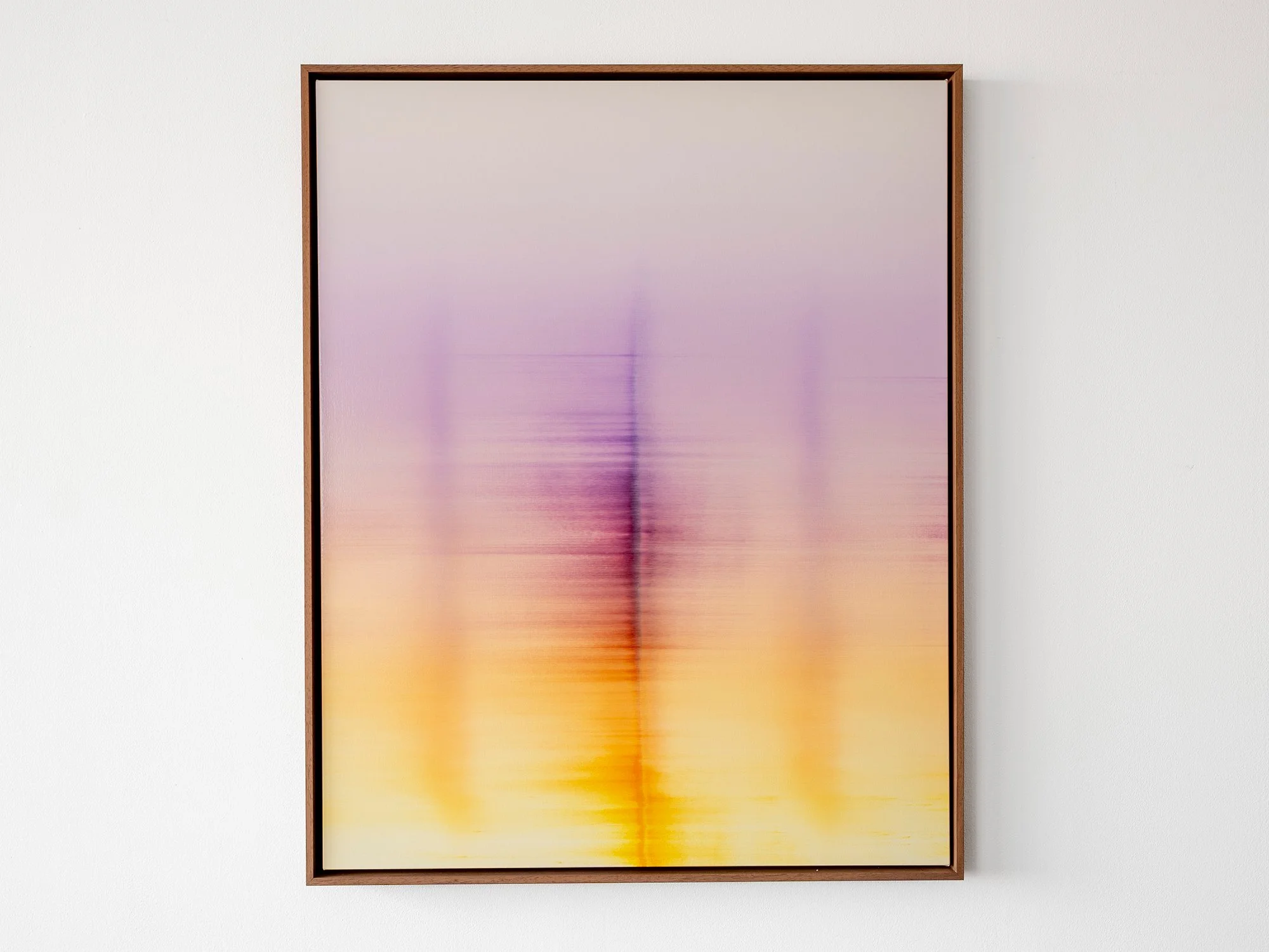 Original oil painting Wandering Phantoms (2026) by Donald Schenkel, featuring soft violet, pink and yellow tones with subtle vertical forms, presented in a custom wooden frame.