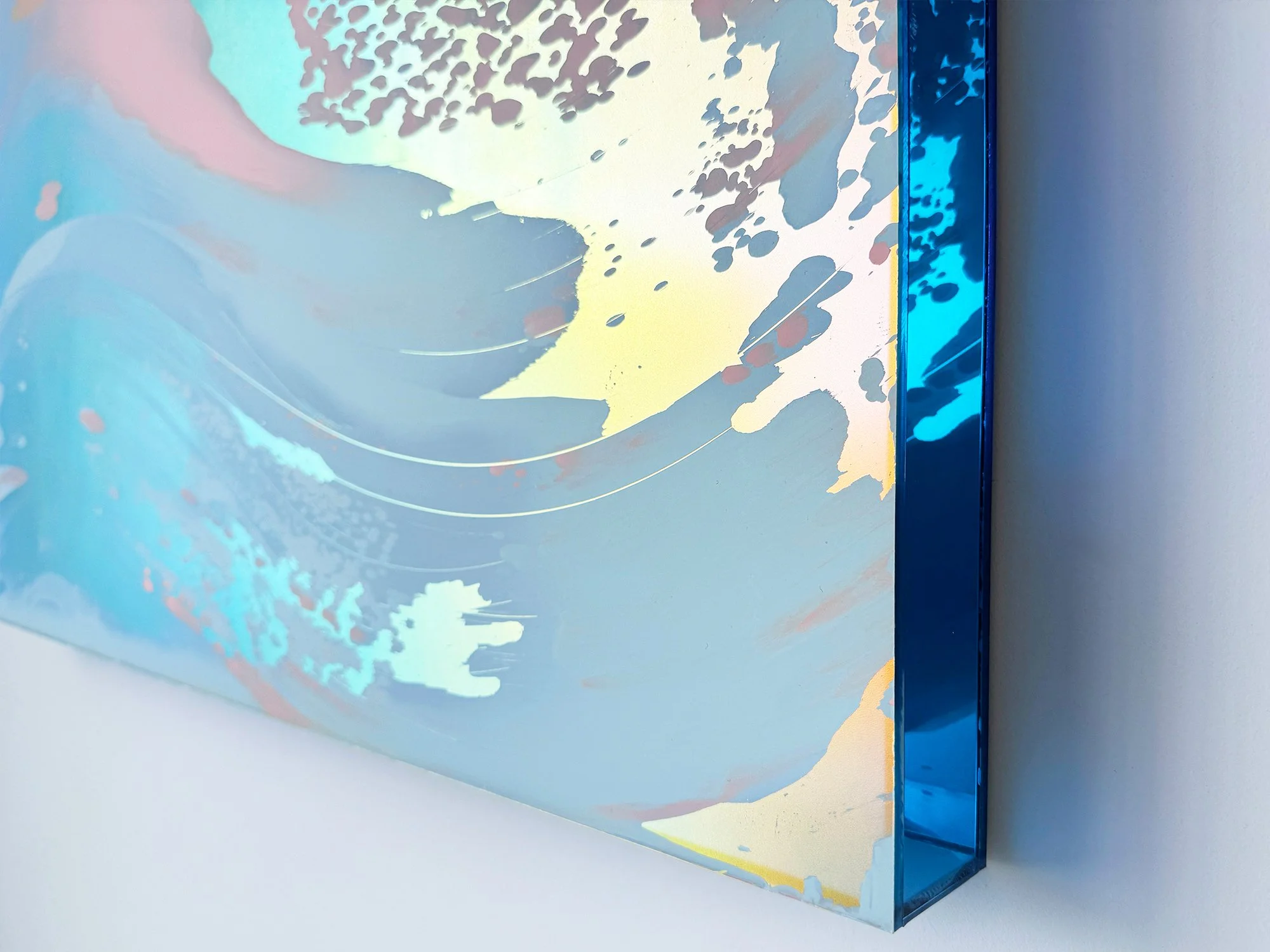 Close-up of Desert Modernism VII by Lisette Schumacher, showing pale blue brushstrokes, yellow accents, a speckled pattern and the blue edge.