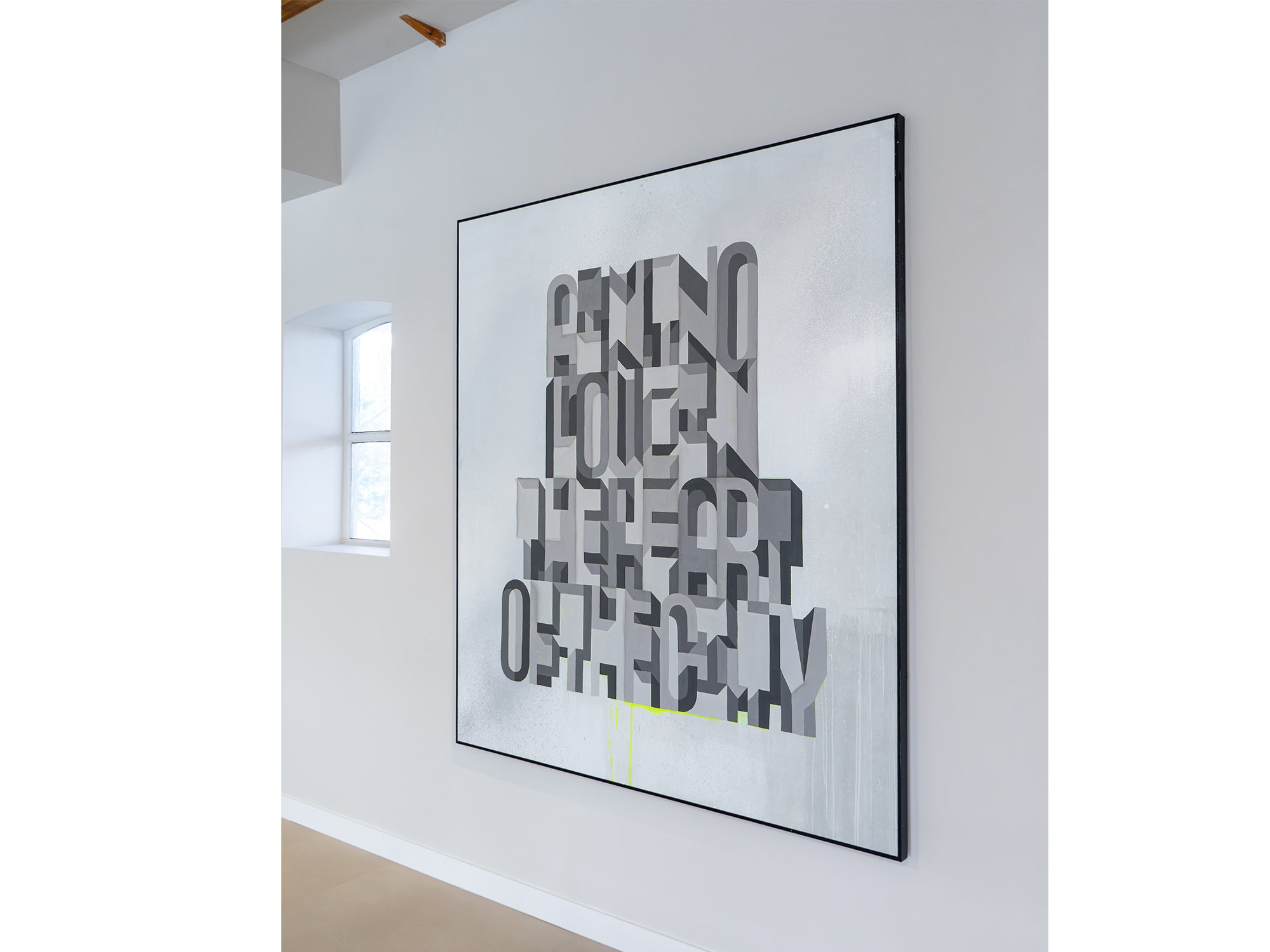 Angled view of Saïd Kinos’s painting, showing the depth and shadows of its overlapping letterforms.