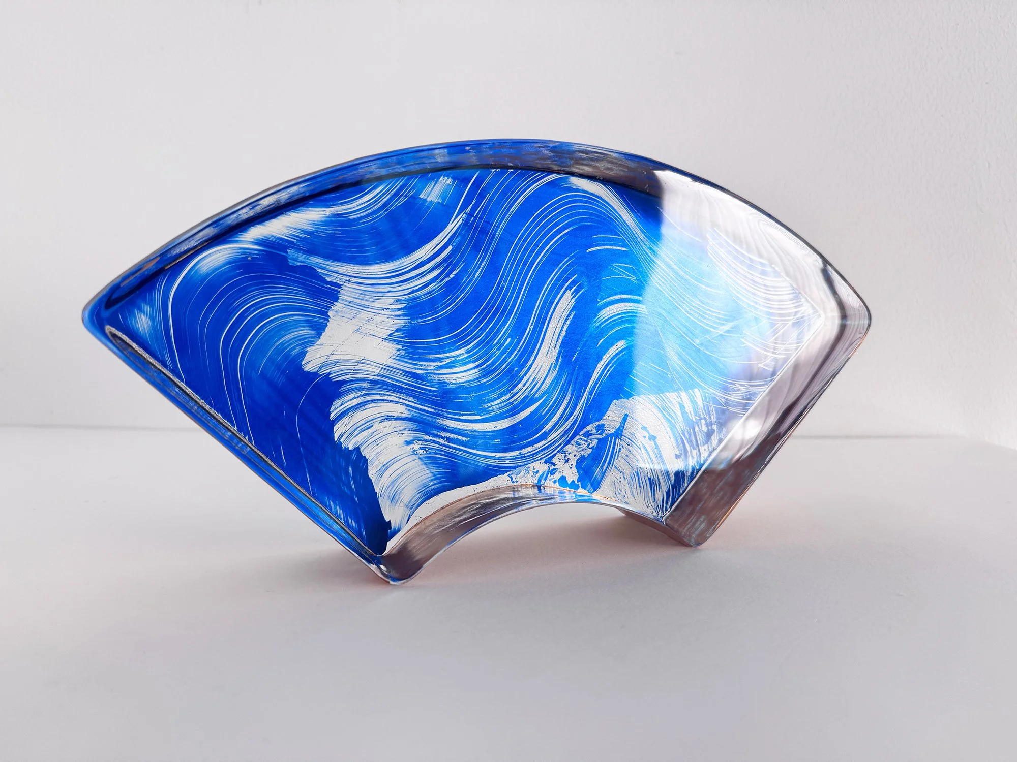 Left side view of Spatial Shade Segment I by Lisette Schumacher, showing the thickness and angled profile of the blue glass sculpture.