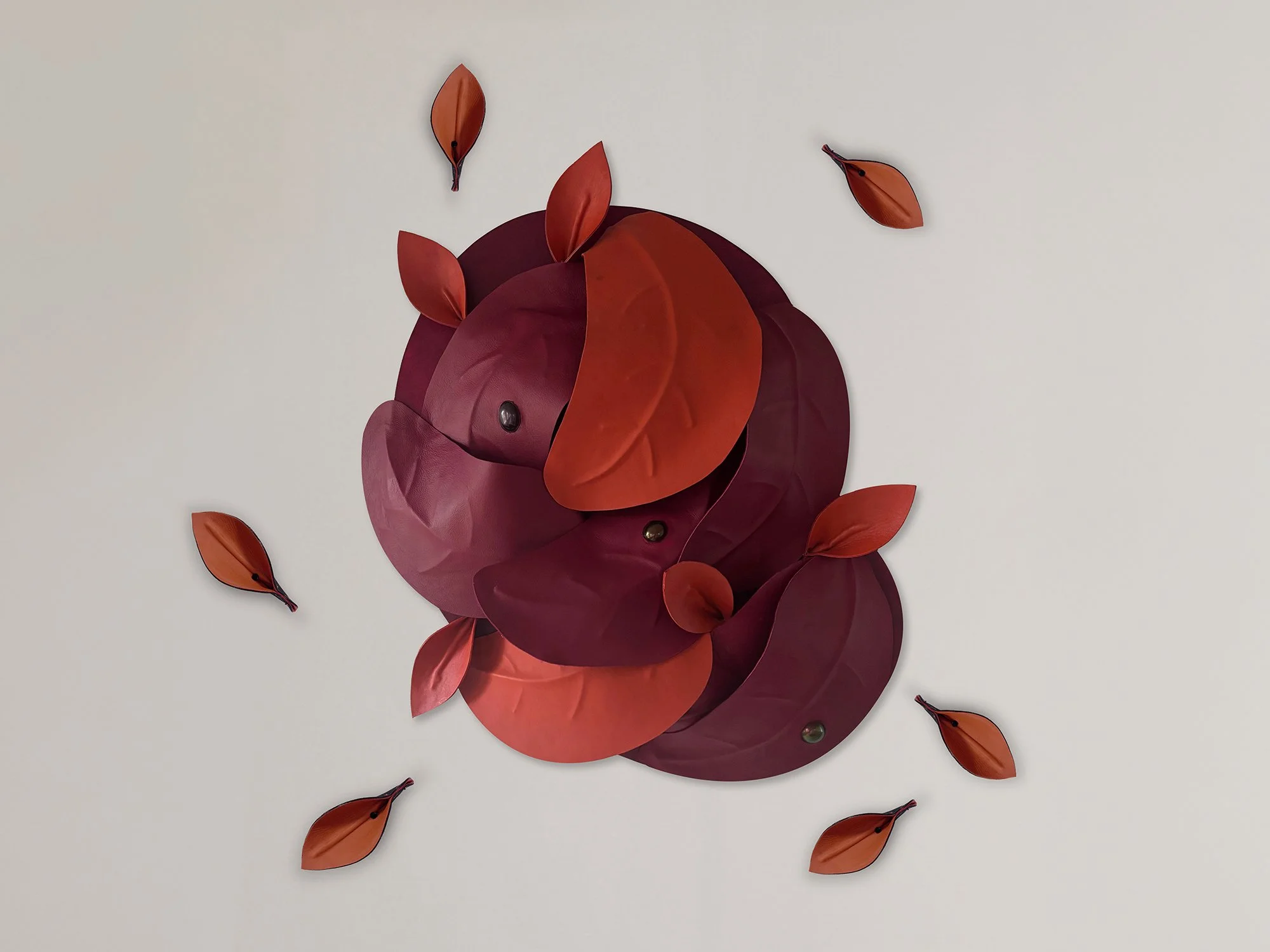 After the Storm – Orange/Red by Madelon Uljee, a sculptural leather wall artwork in orange, rust and burgundy.