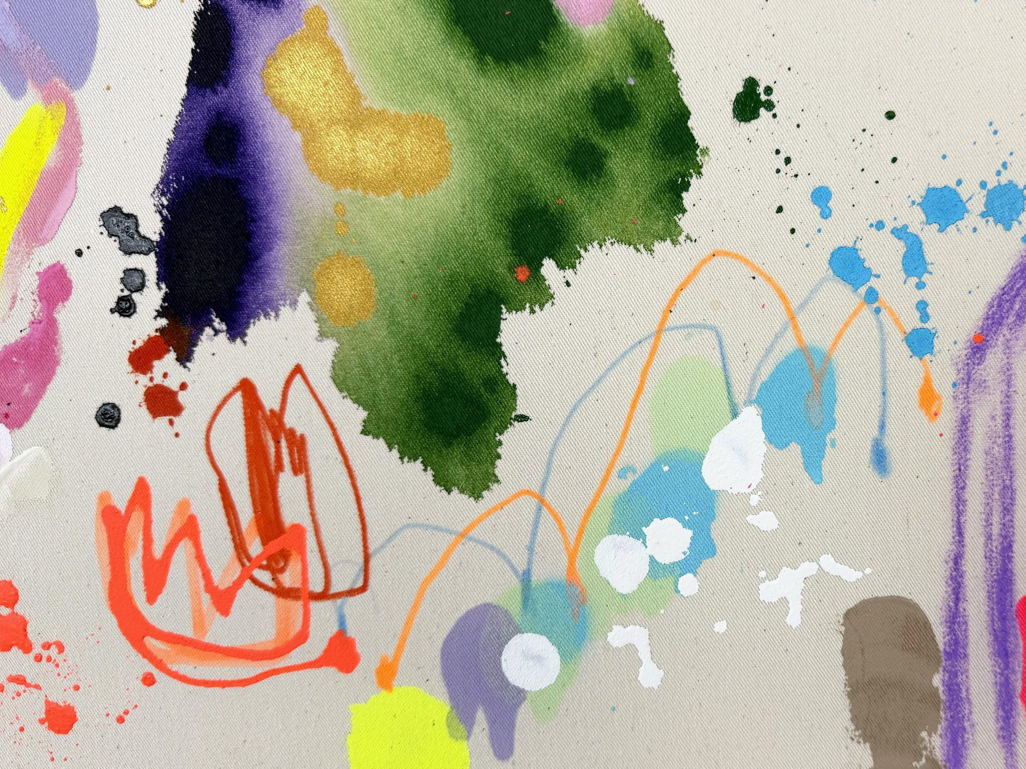 Detail of expressive paint gestures with green pigment spreading into raw canvas and small black splashes