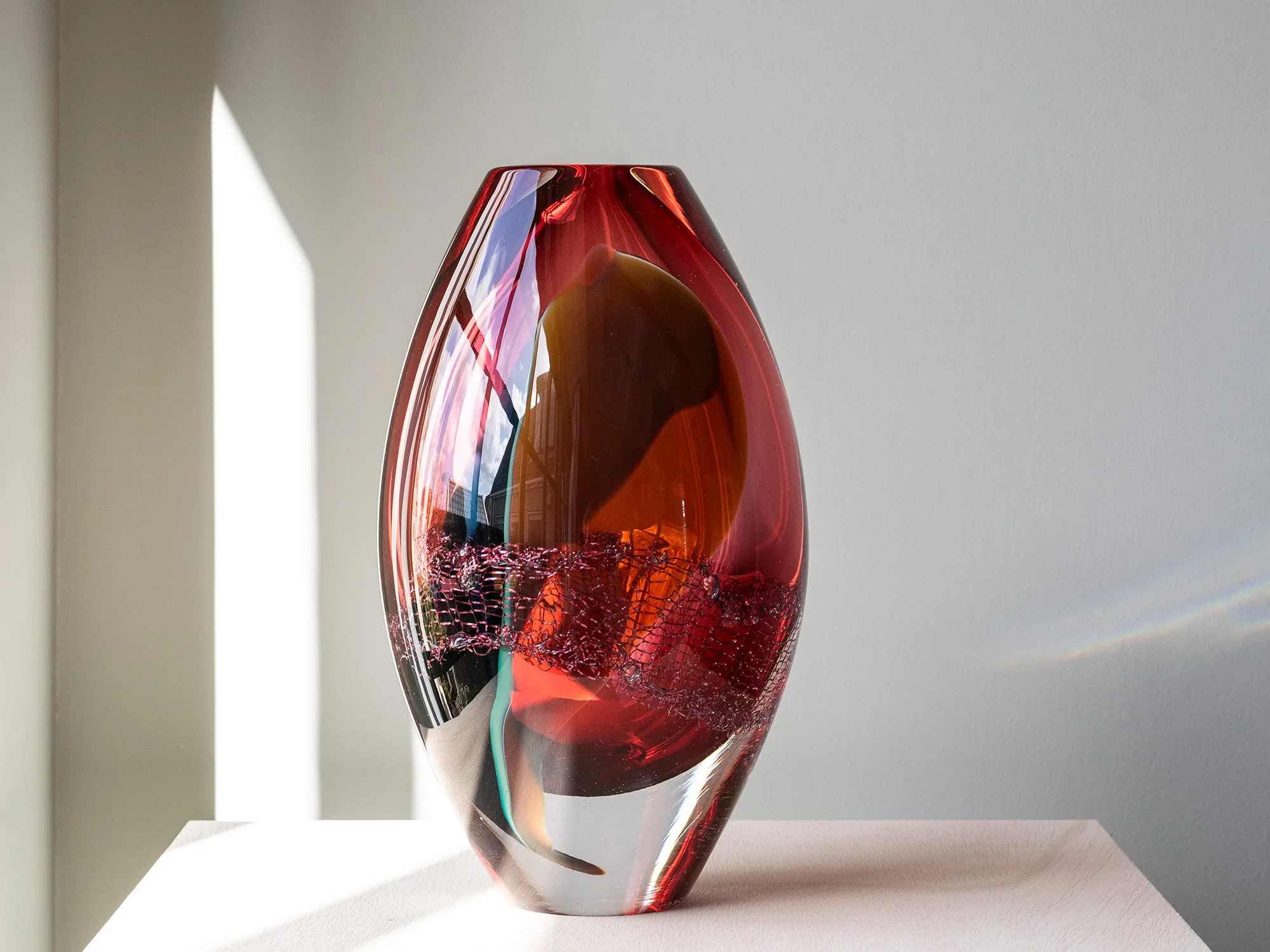 Francisca Snel glass sculpture showing soft pink and red tones from a different angle