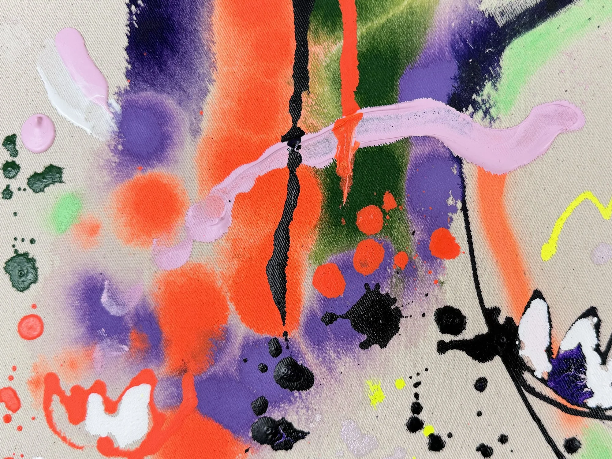Detail of abstract mixed media painting by Vera Klaus showing neon green and orange paint, splashes and gestural marks on raw canvas.