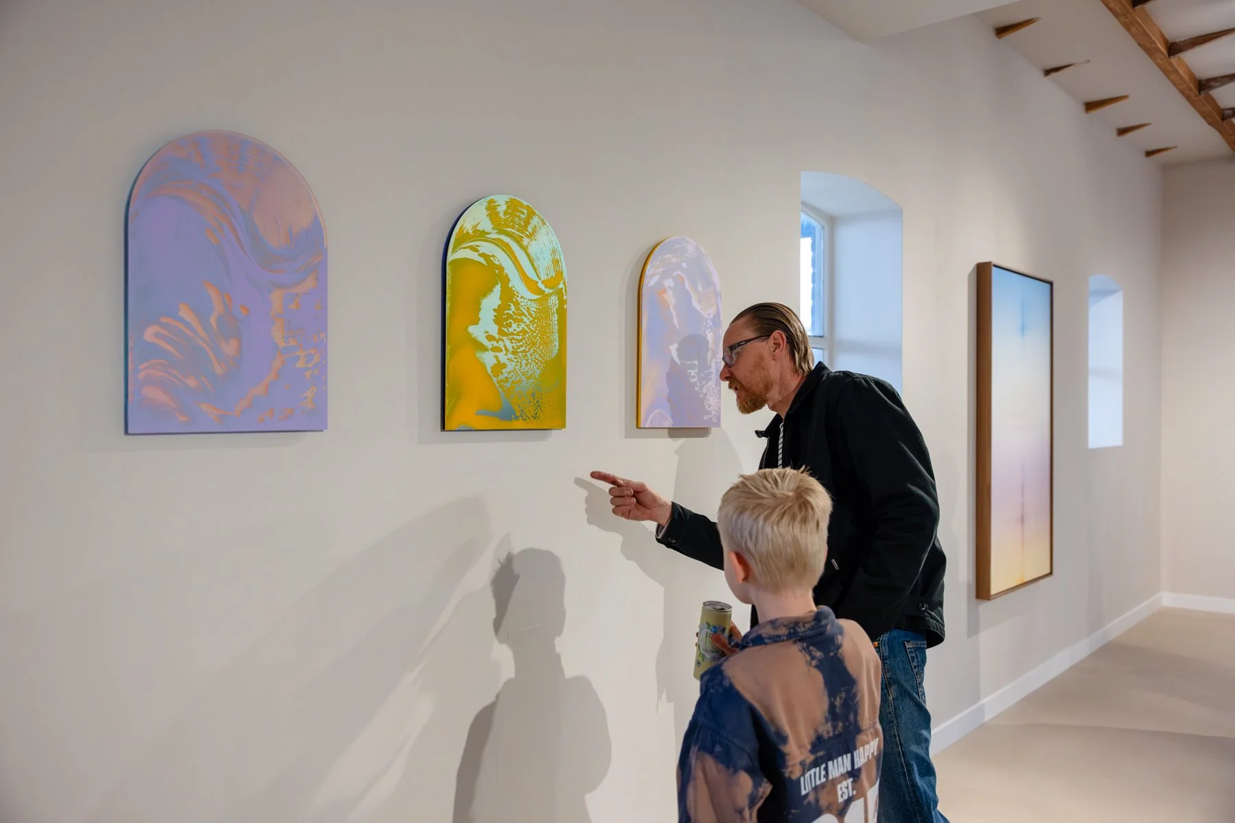 Lisette Schumacher’s Arch I presented in a gallery setting, with the curved shape framing the composition against a neutral wall.