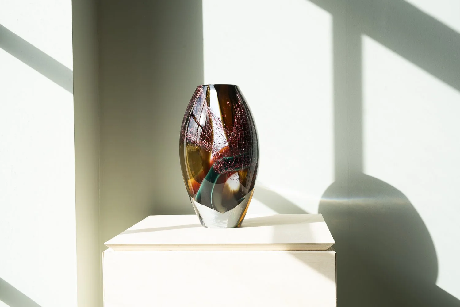 Crystal Clear #14 by Francisca Snel without direct sunlight, revealing its reddish-brown tones and intricate internal texture.