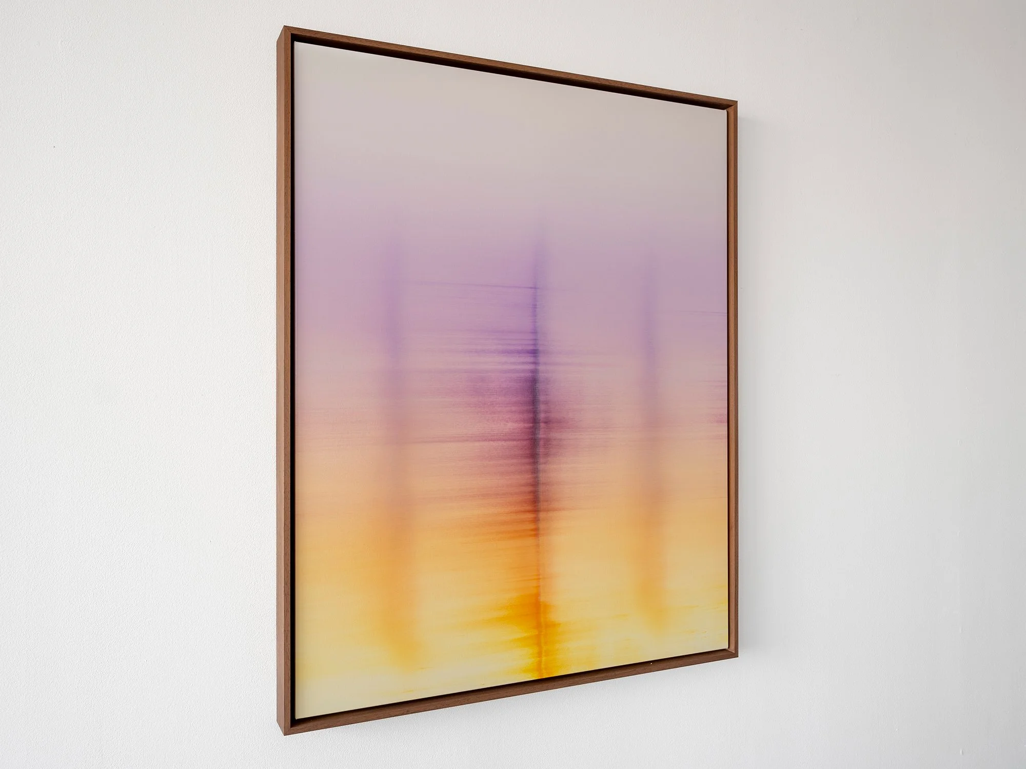 Side view of Wandering Phantoms (2026) by Donald Schenkel, showing the depth of the stretched canvas and the custom wooden frame surrounding the luminous oil painting