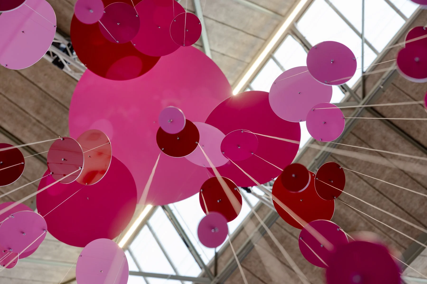 Detail of Threes by Freerk Wilbers showing layered aluminium elements, glossy surfaces and subtle movement within space.