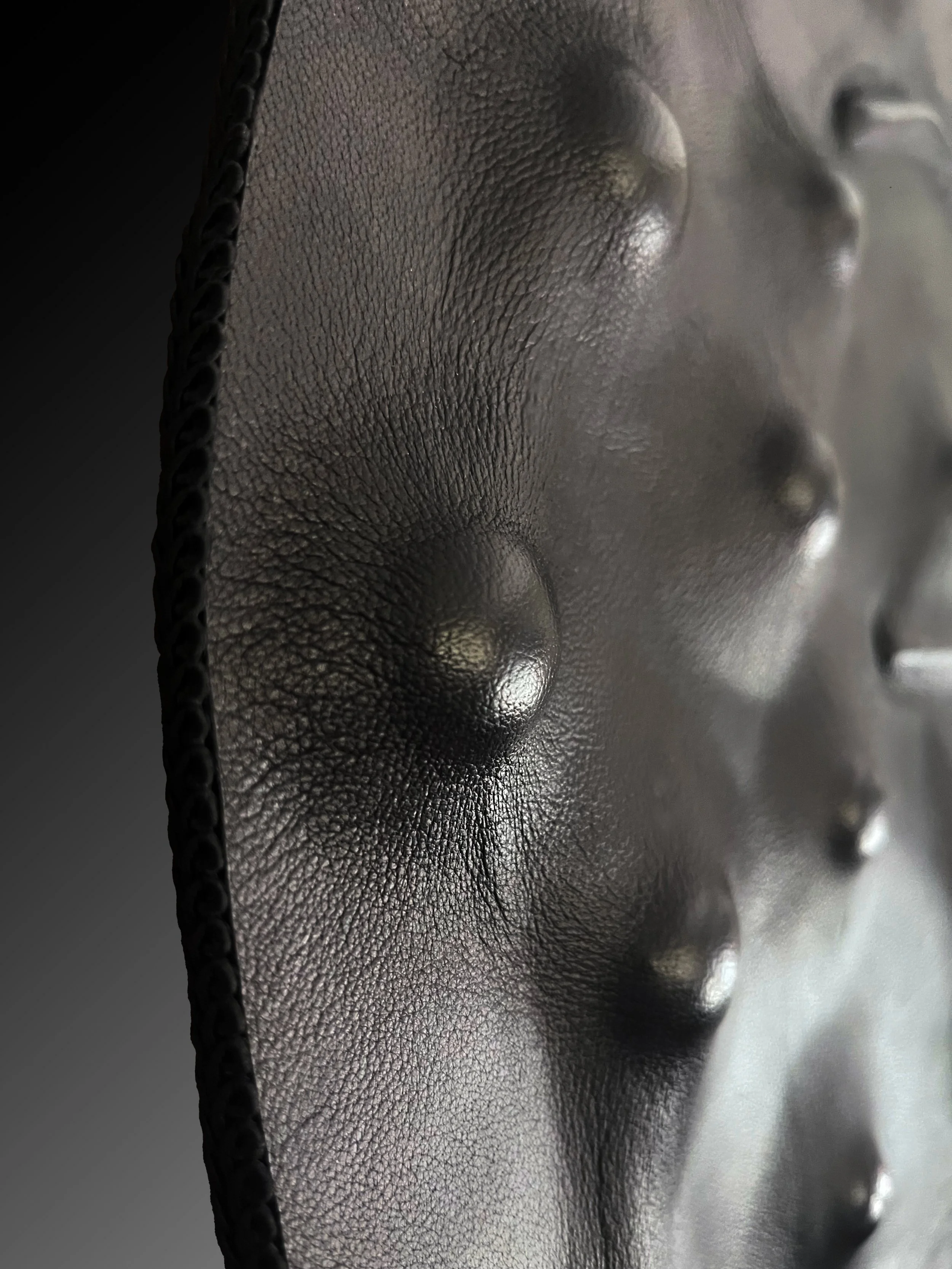 Detail of hand-shaped leather surface by Madelon Uljee, revealing texture, movement and structure