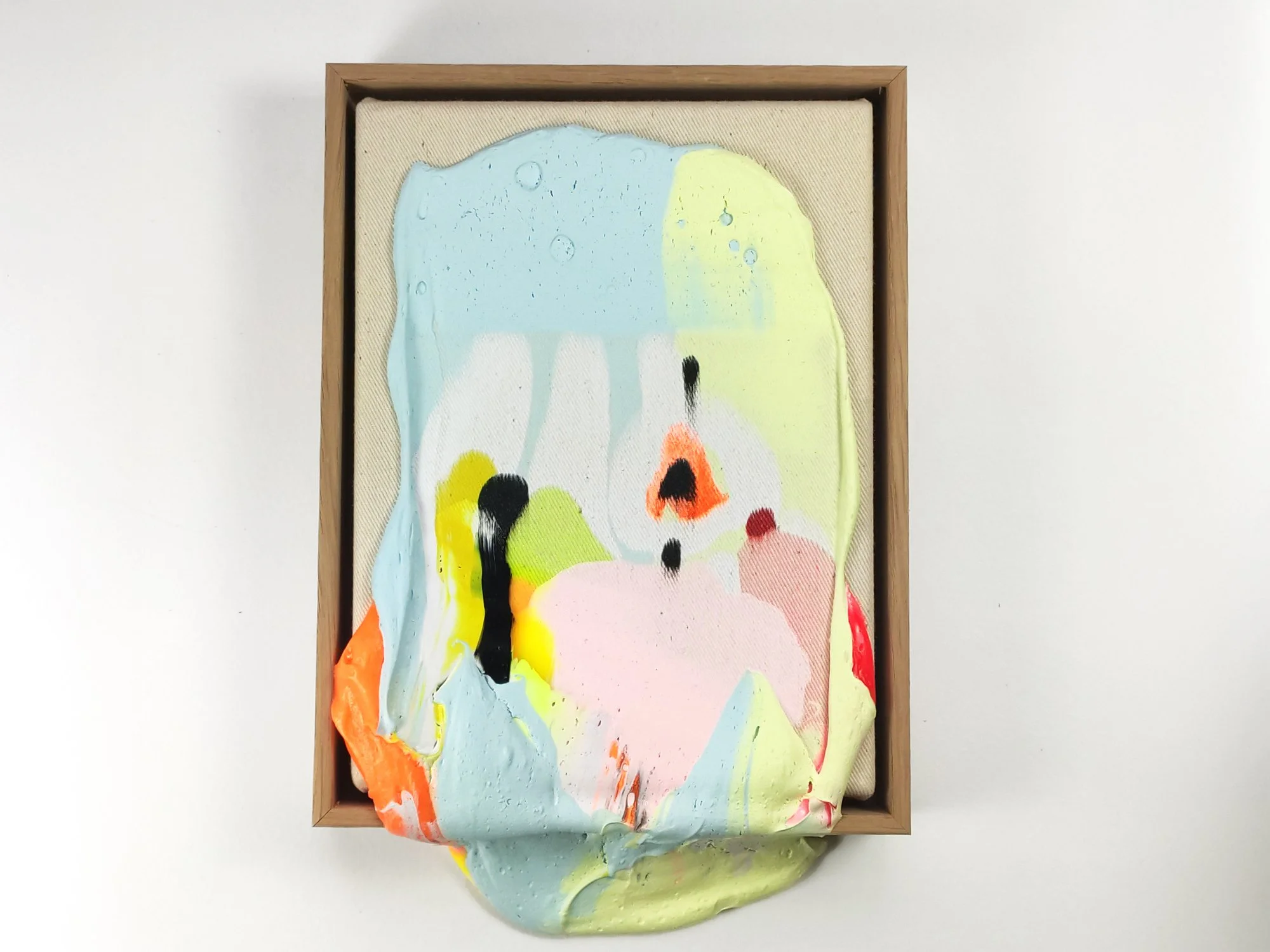 Poppie series painting by Karen van de Vliet shown on a white wall, featuring sculptural paint layers and textured acrylic surfaces.
