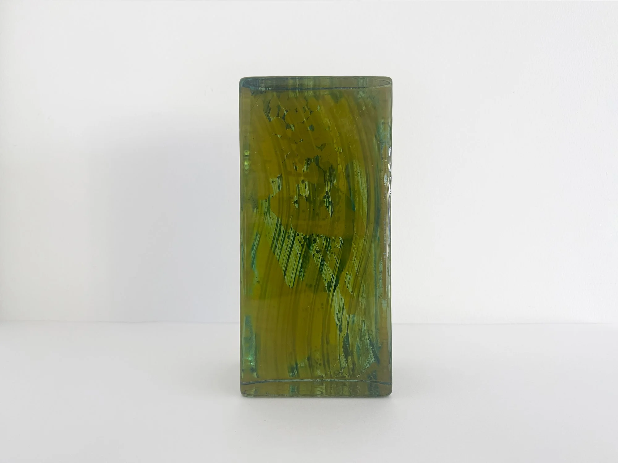 Contemporary glass artwork by Lisette Schumacher showing light passing through transparent coloured glass