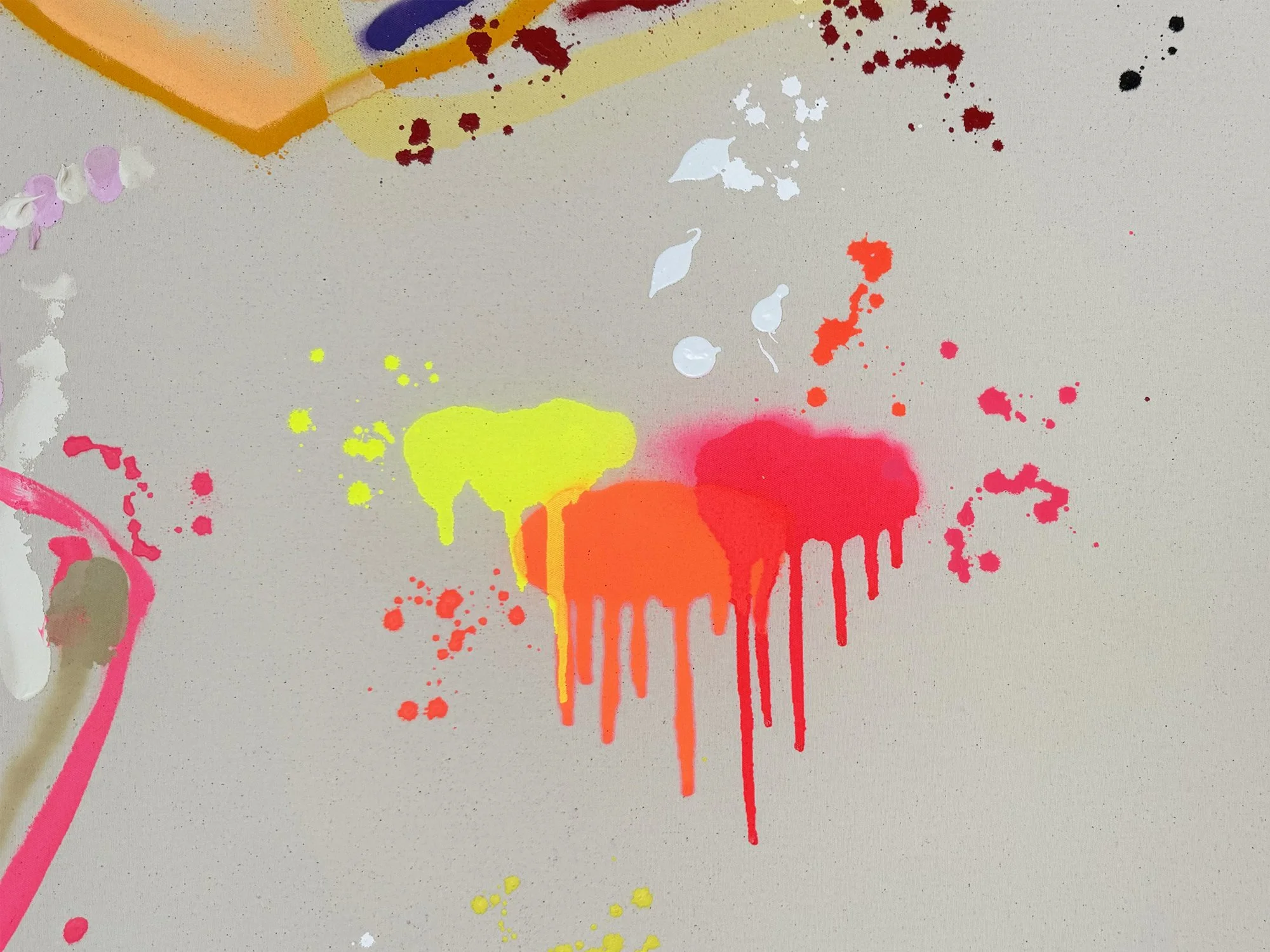Detail showing neon pink and yellow paint splashes on raw canvas