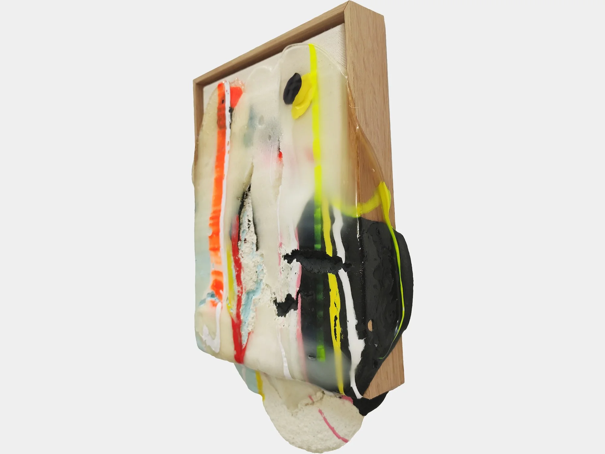 Side view revealing the layered surface and sculptural depth of the composition within its wooden frame.