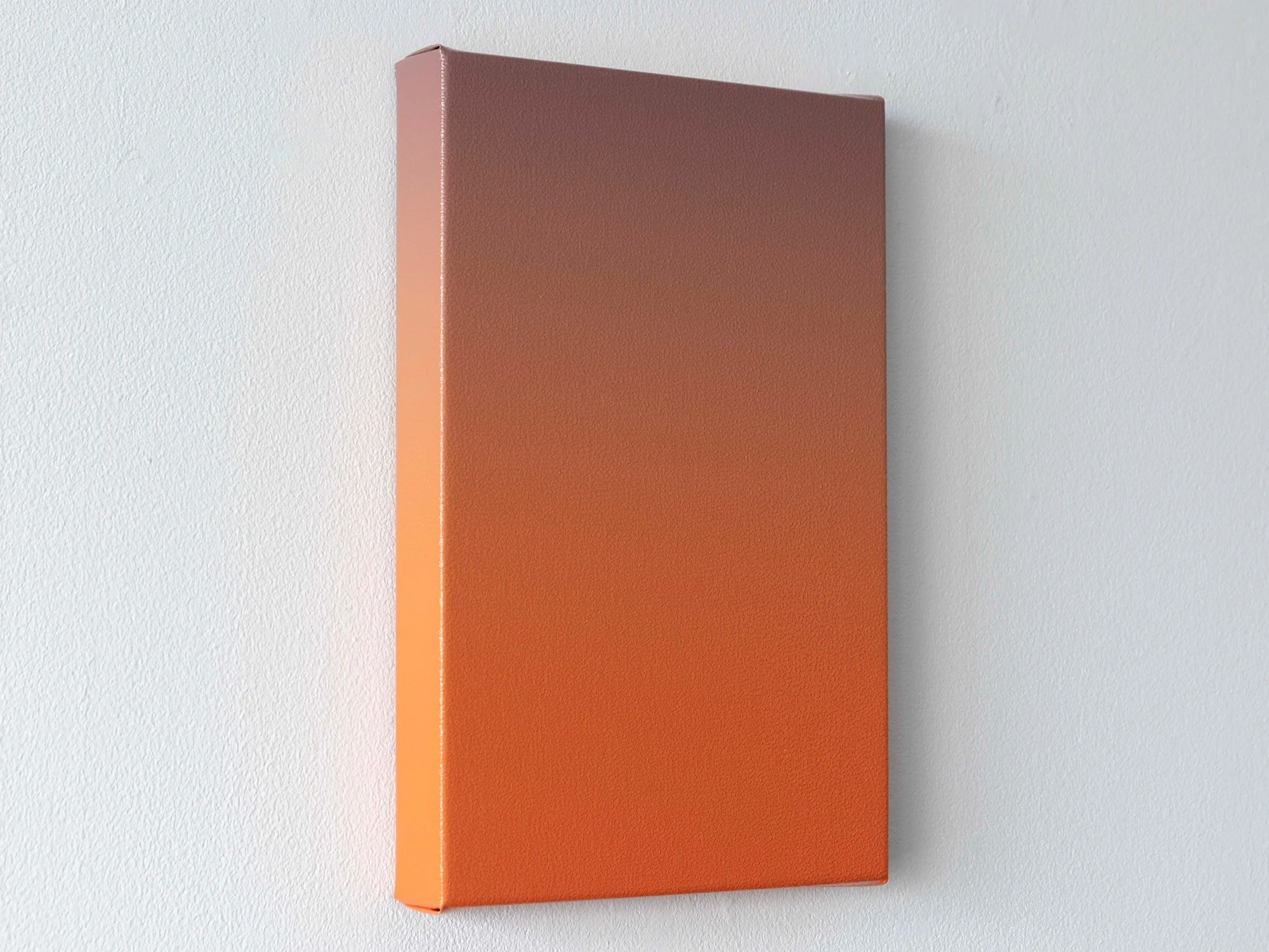 Side angle of Donald Schenkel’s Orange Dusk painting, showing the canvas depth and warm gradient tones.