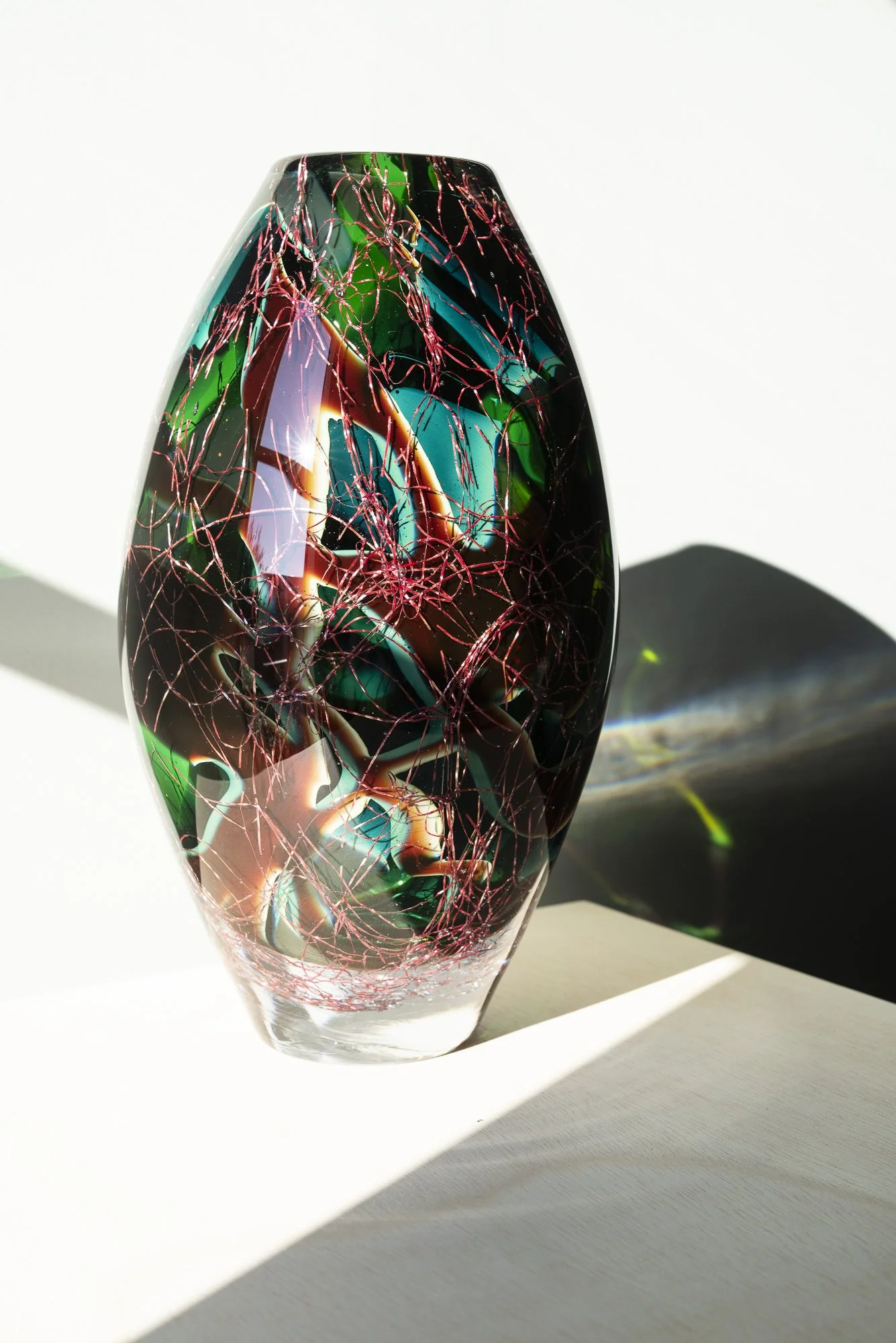 Side view of Magnitude #18 by Francisca Snel, showing its rounded form and dense internal structure.