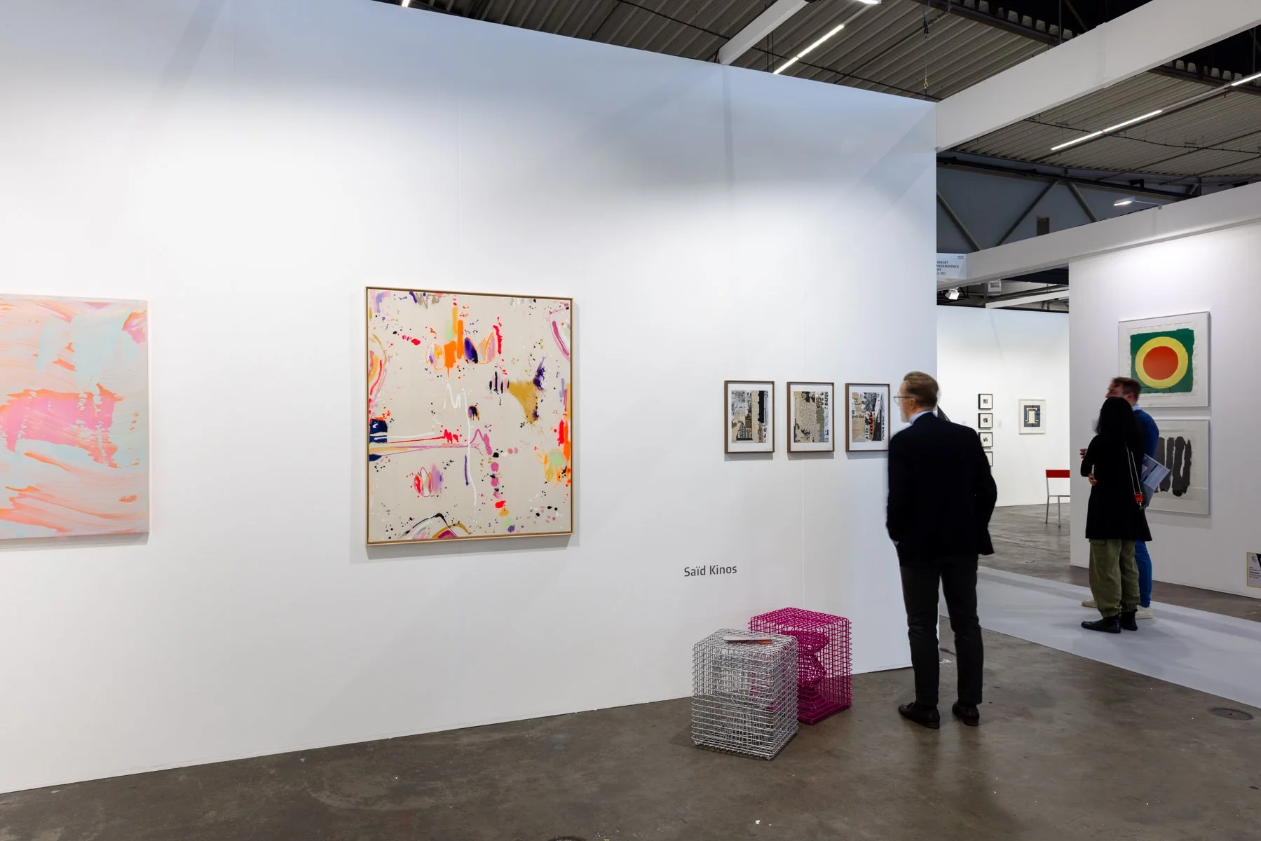 Root Gallery booth at Art Rotterdam 2025 with a curated selection of vibrant paintings, conceptual photography, and mixed media works