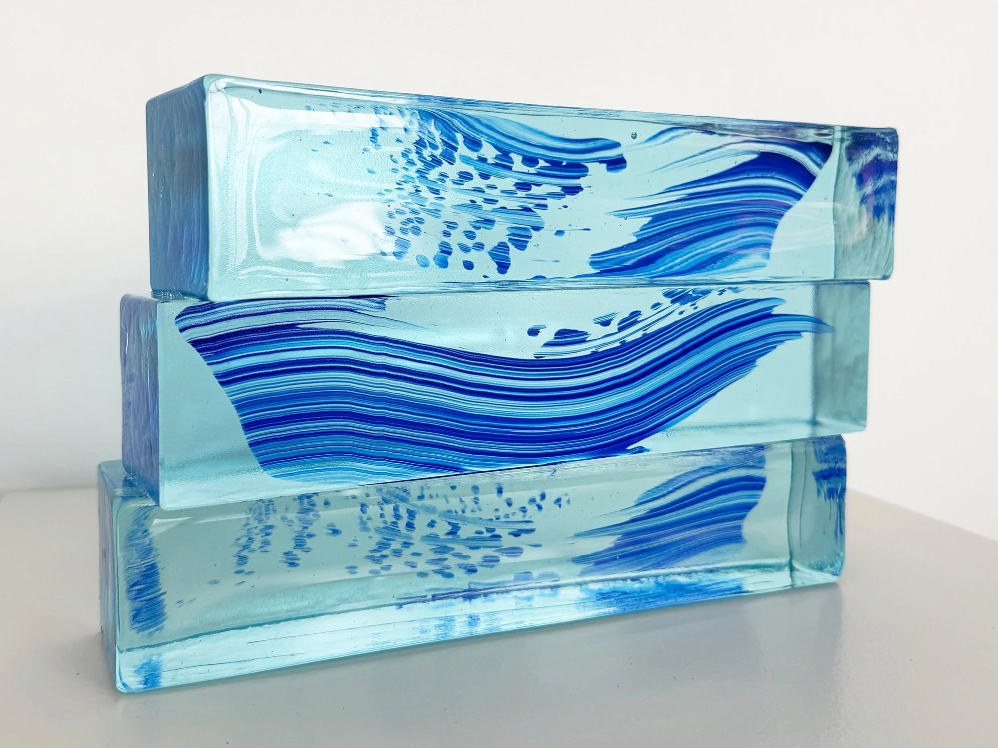 Spatial Shade I – solid glass sculpture by Lisette Schumacher on display against a white wall