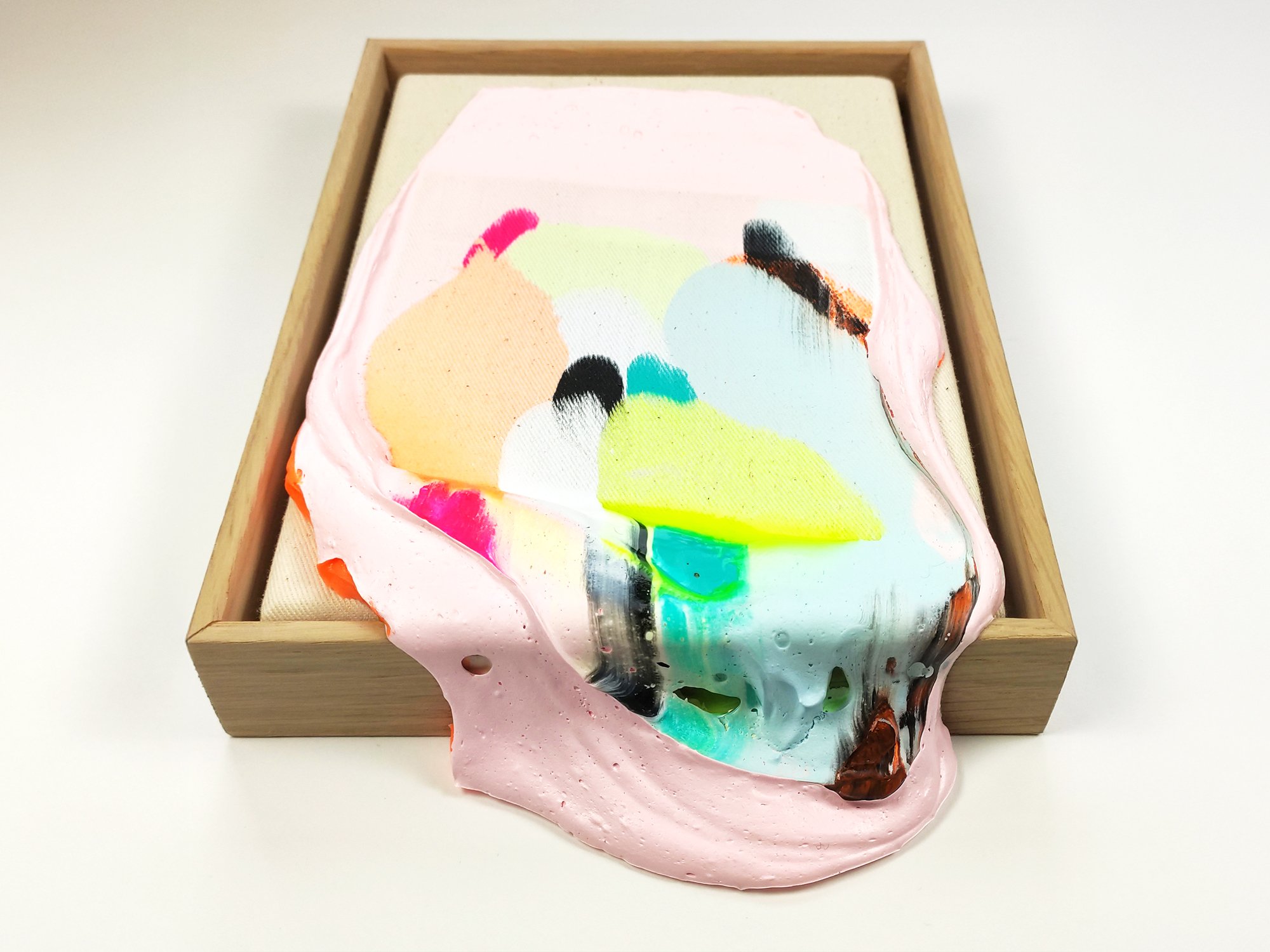 side view of a Poppie painting showing the thickness of the paint, acrylic textures and curved, built-up edges.