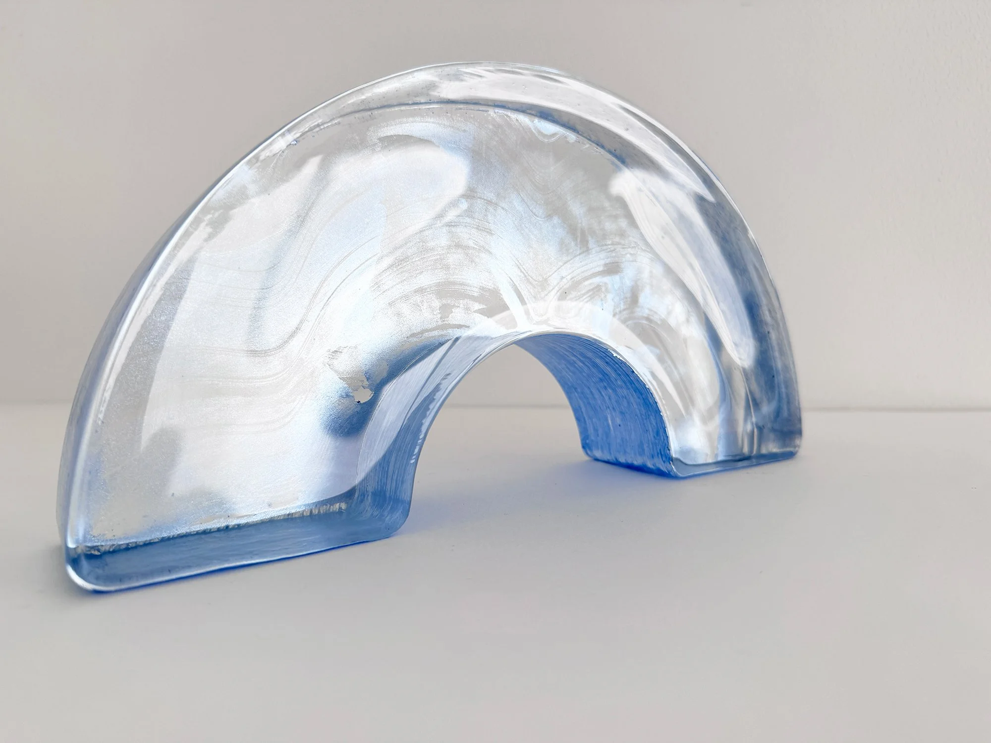 Left side view of Spatial Shade Arch I by Lisette Schumacher, showing the depth of the solid glass arch.