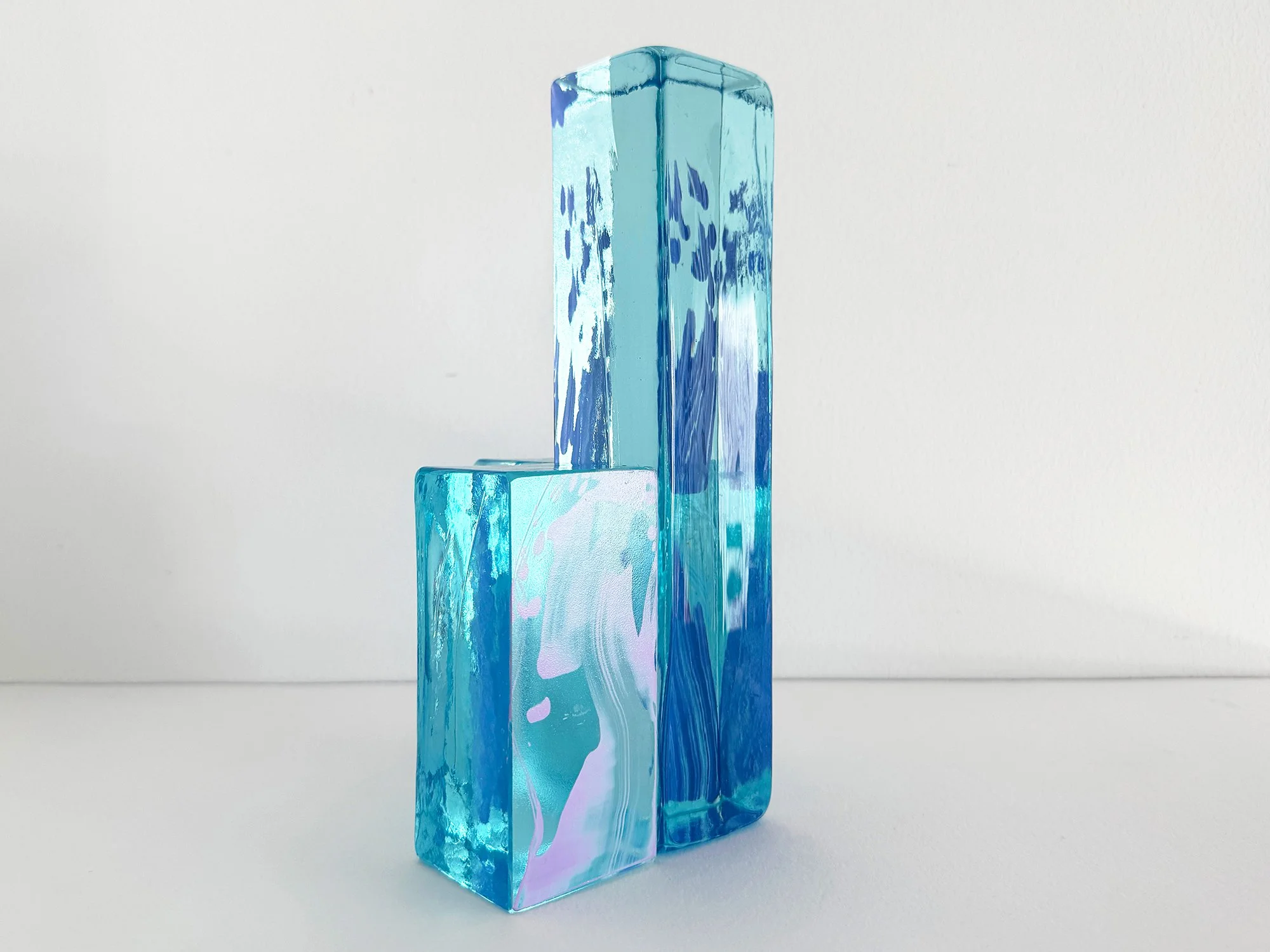 Modern collectible glass sculpture with vertical composition and transparent structure