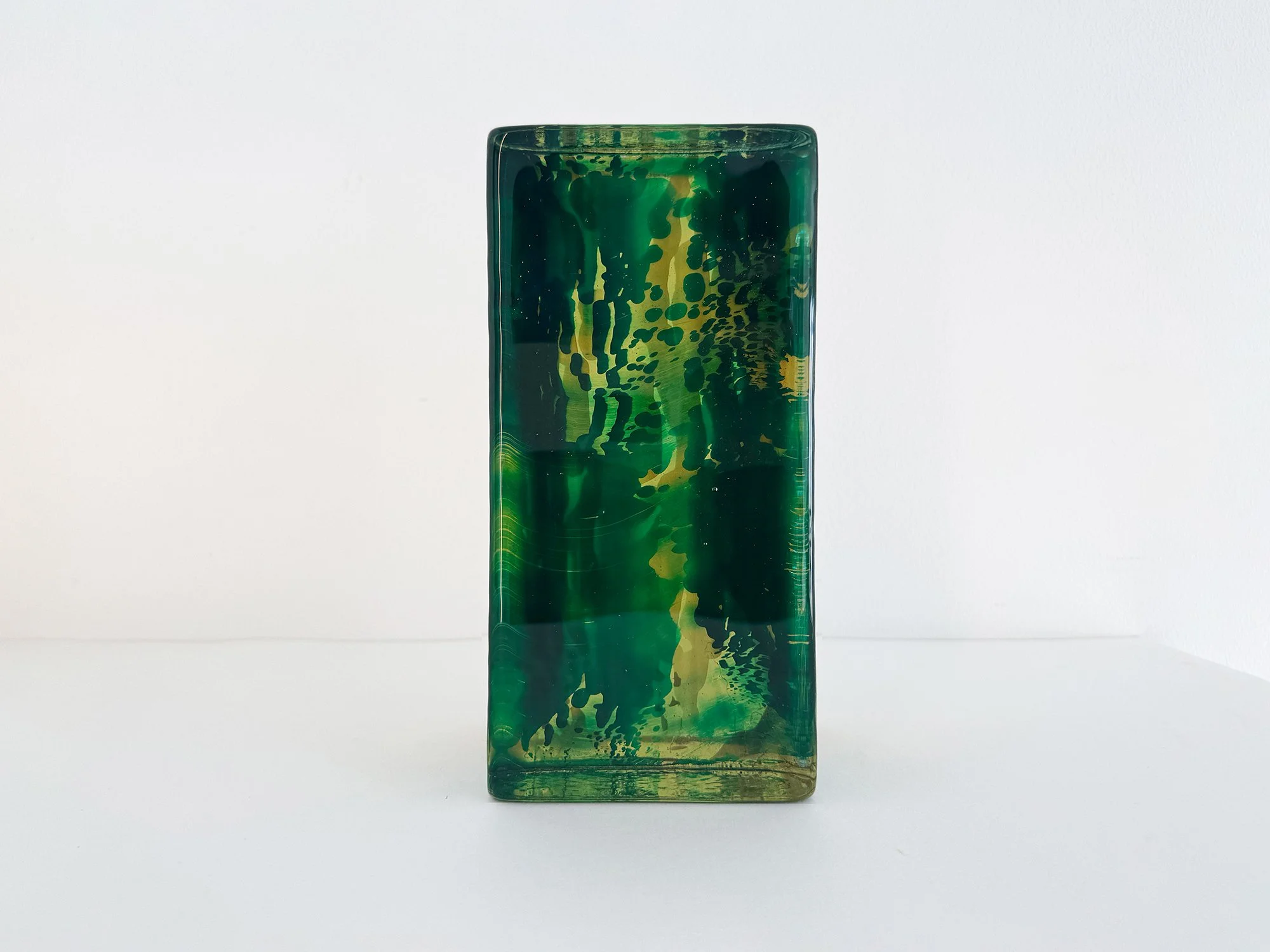 Solid glass sculpture by Lisette Schumacher showing layered transparent glass and depth