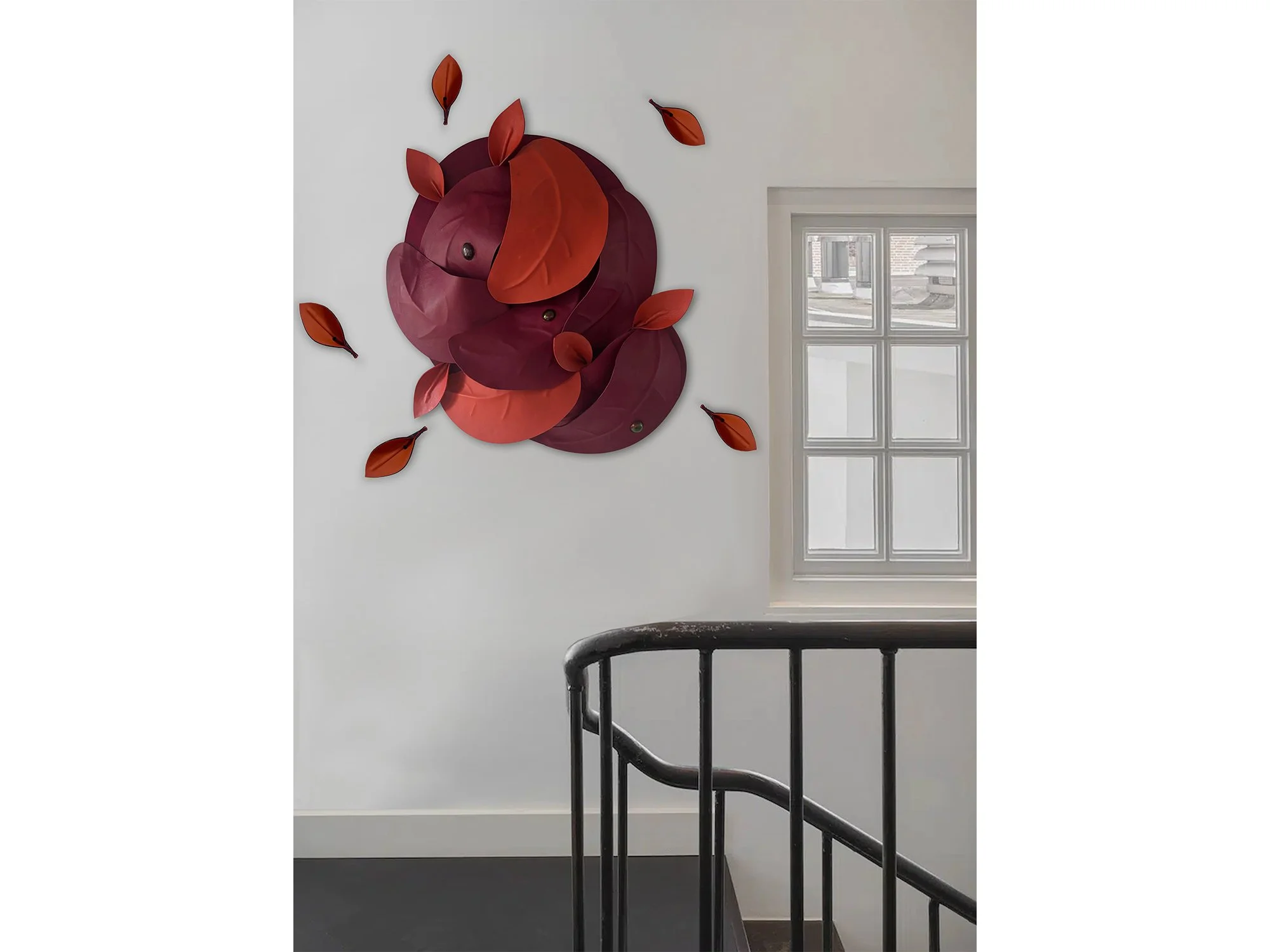 After the Storm – Orange/Red by Madelon Uljee presented with individual leather leaves in a contemporary interior.