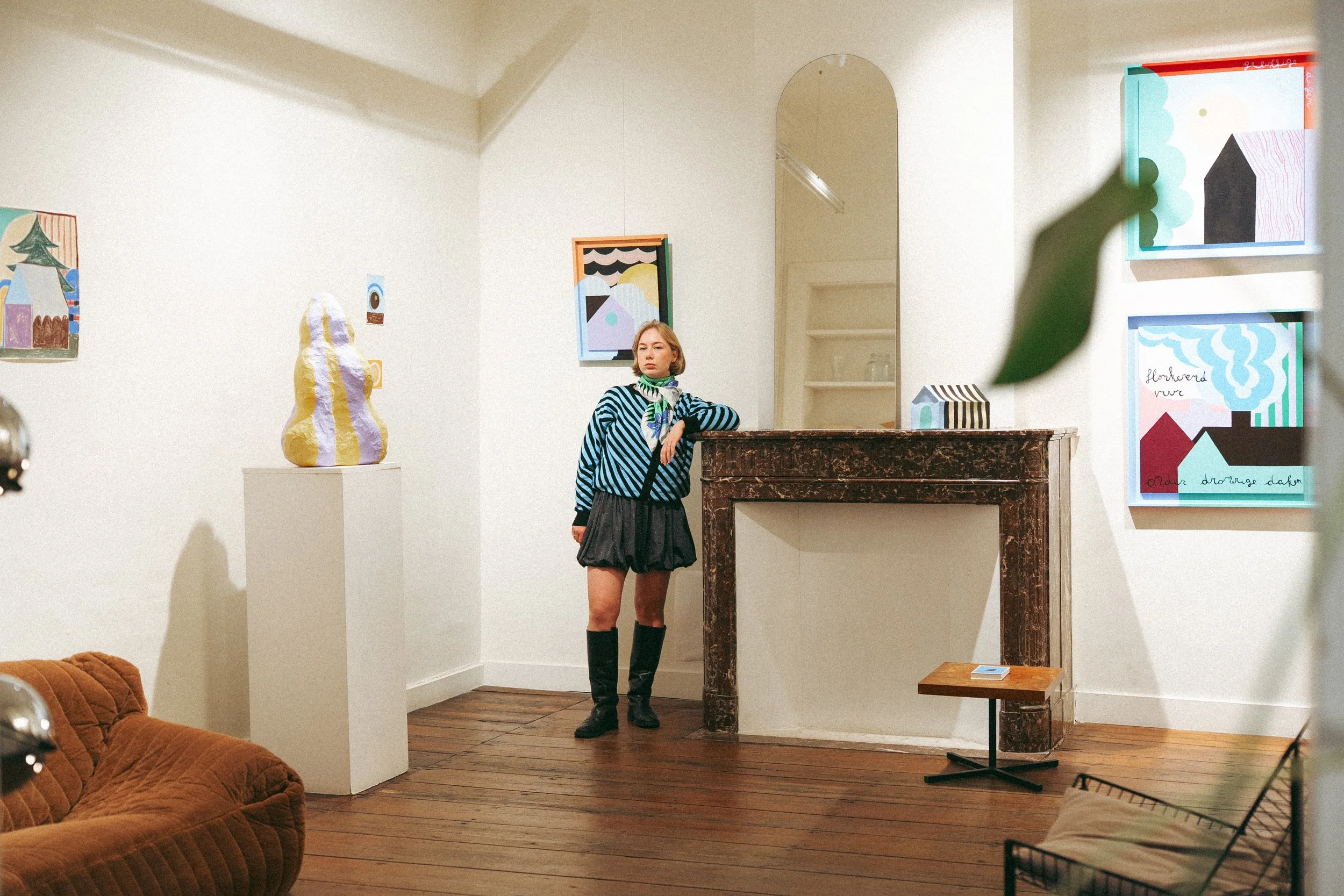 Belgium artist Emma Veulemans surrounded by her sculptures and paintings