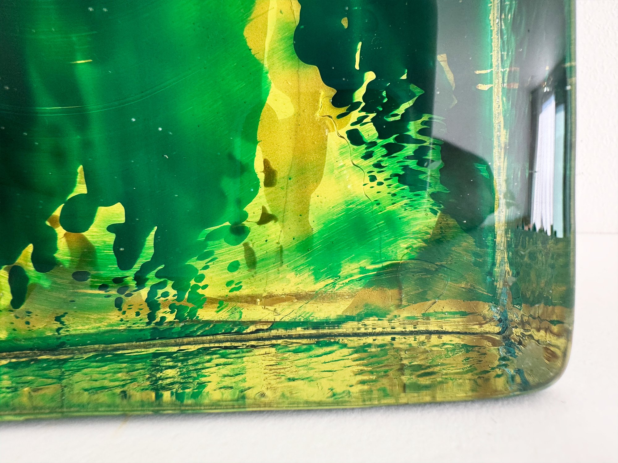 Close-up of handmade glass sculpture by Lisette Schumacher showing reflections in solid glass