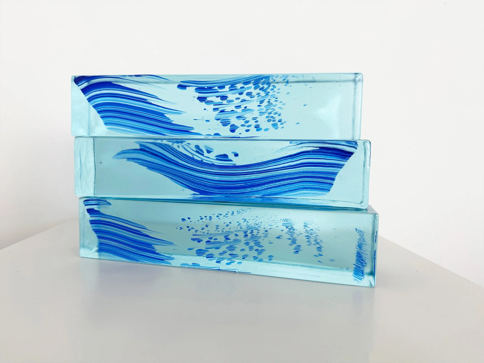 Front view of Spatial Shade I showing smooth blue glass surface