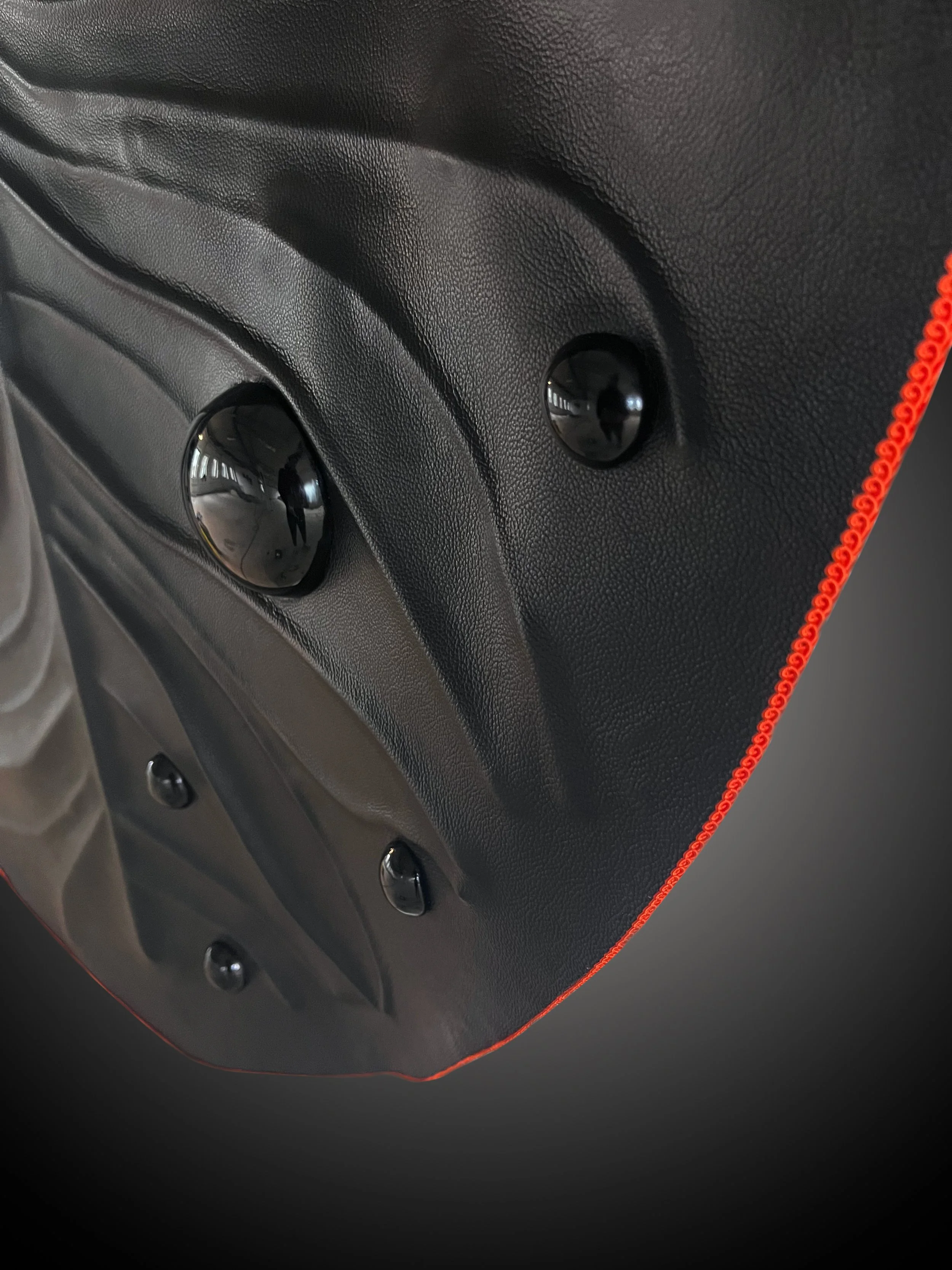 Close-up of Madelon Uljee leather artwork showing texture, folds and surface tension