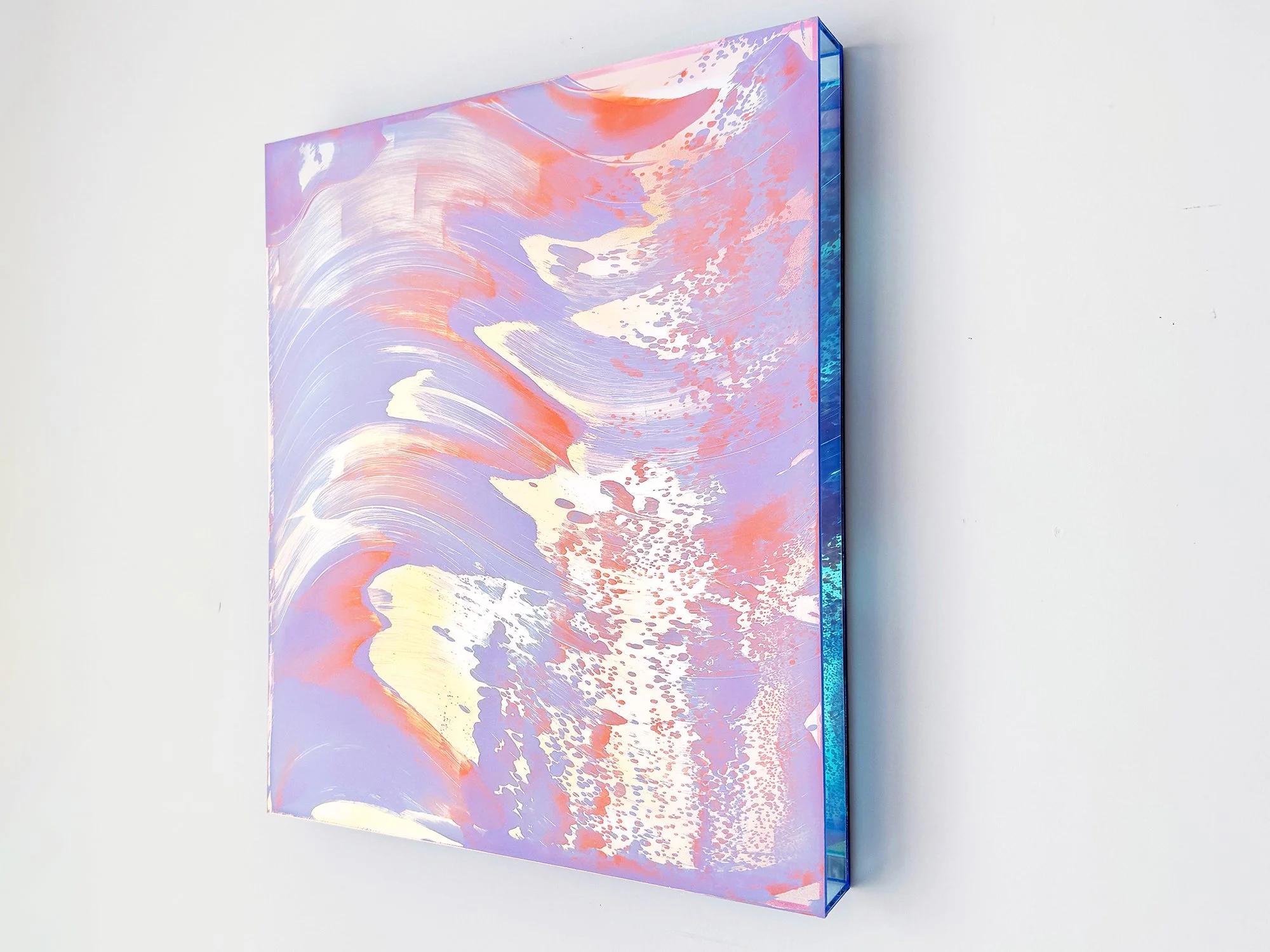 Side view of abstract artwork with iridescent blue edges and layered paint surface, mixed media by Lisette Schumacher