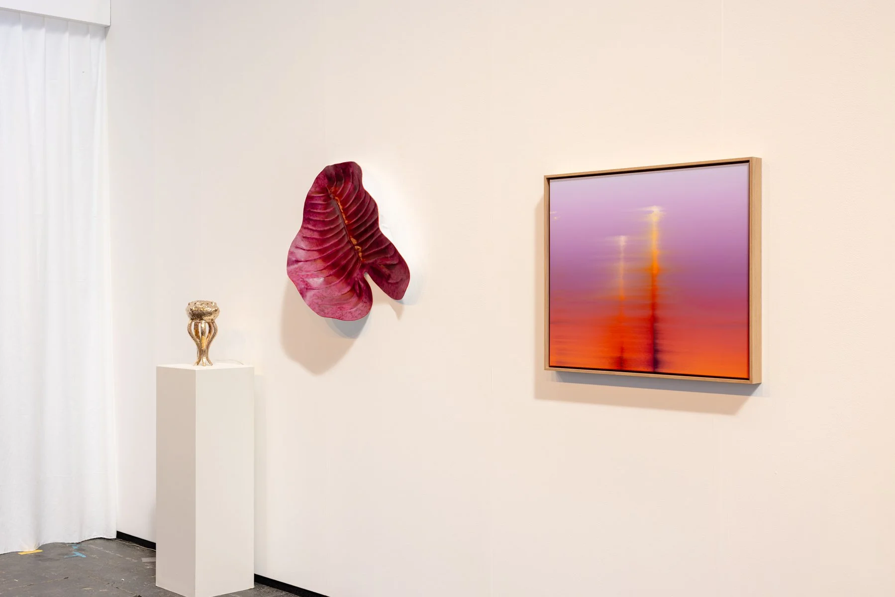 Pink leather sculptural wall work by Madelon Uljee installed at KunstRAI, shown within a gallery booth alongside surrounding artworks