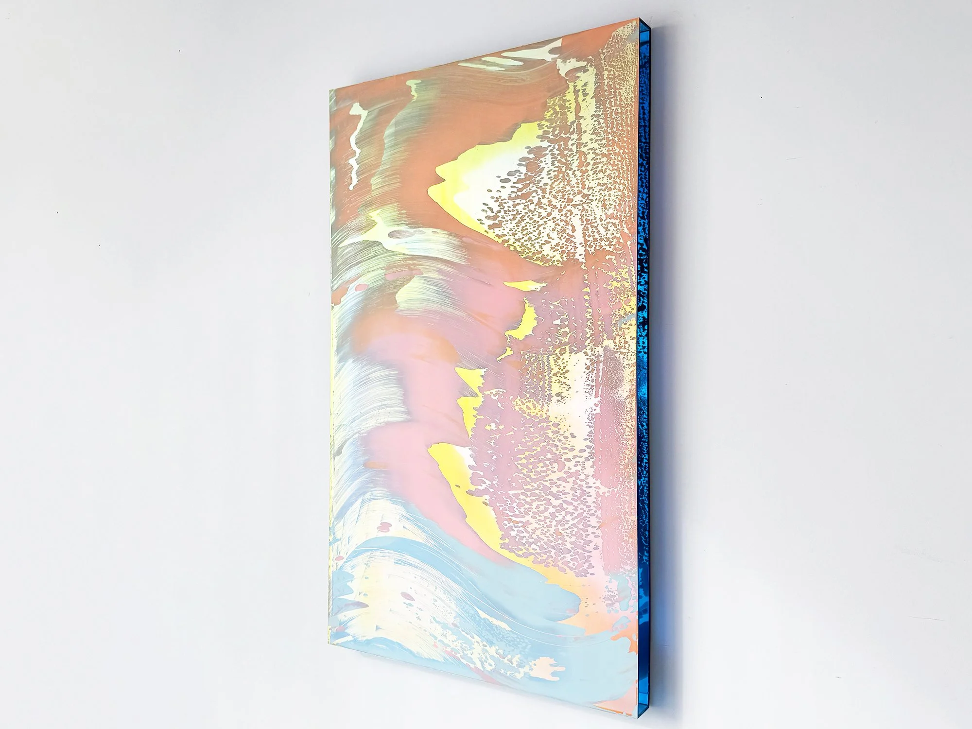 Angled view of Desert Modernism VII by Lisette Schumacher, showing its layered pastel colours, textured surface and deep blue edge.