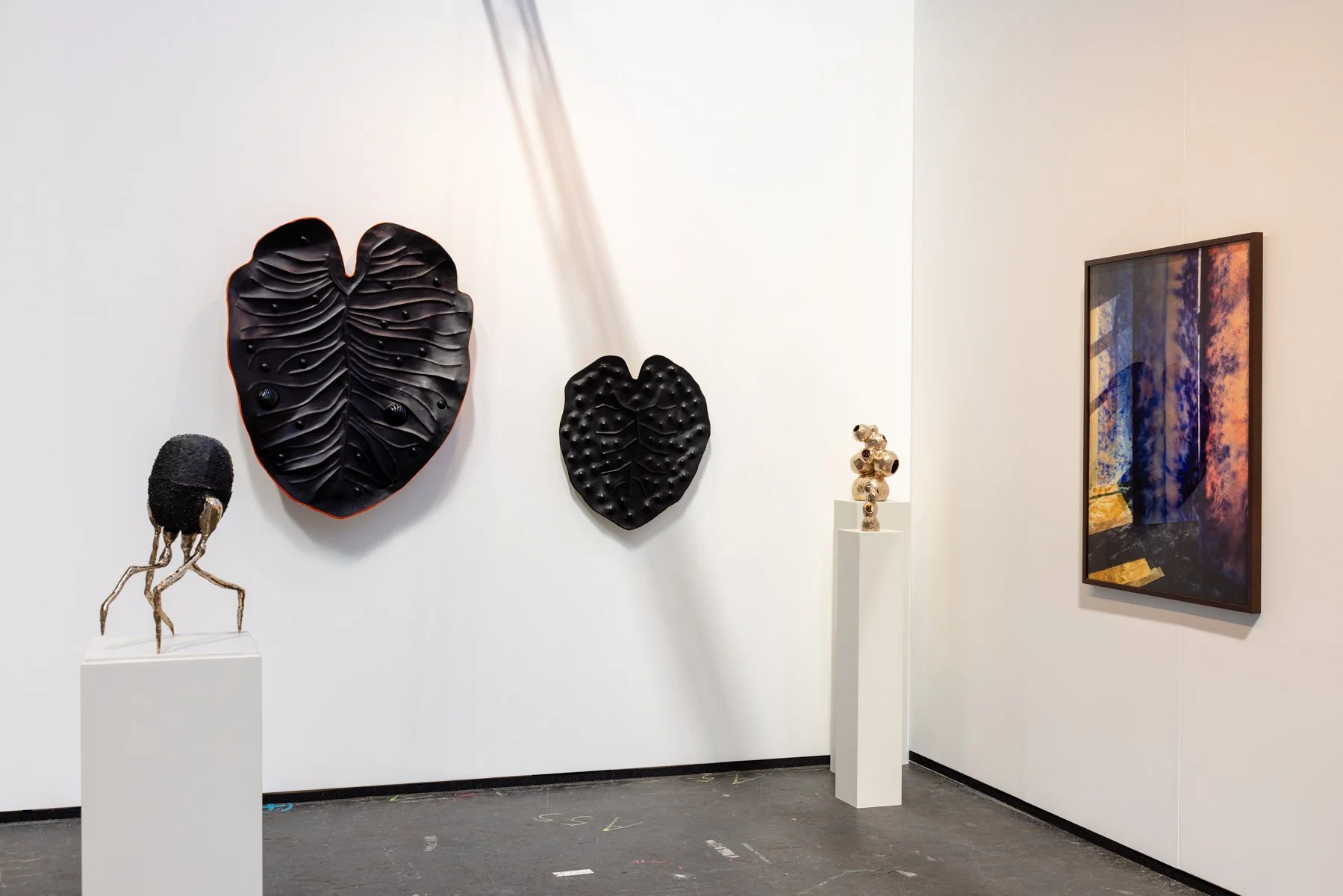 Contemporary leather wall sculpture by Madelon Uljee shown at KunstRAI, front view without visitors