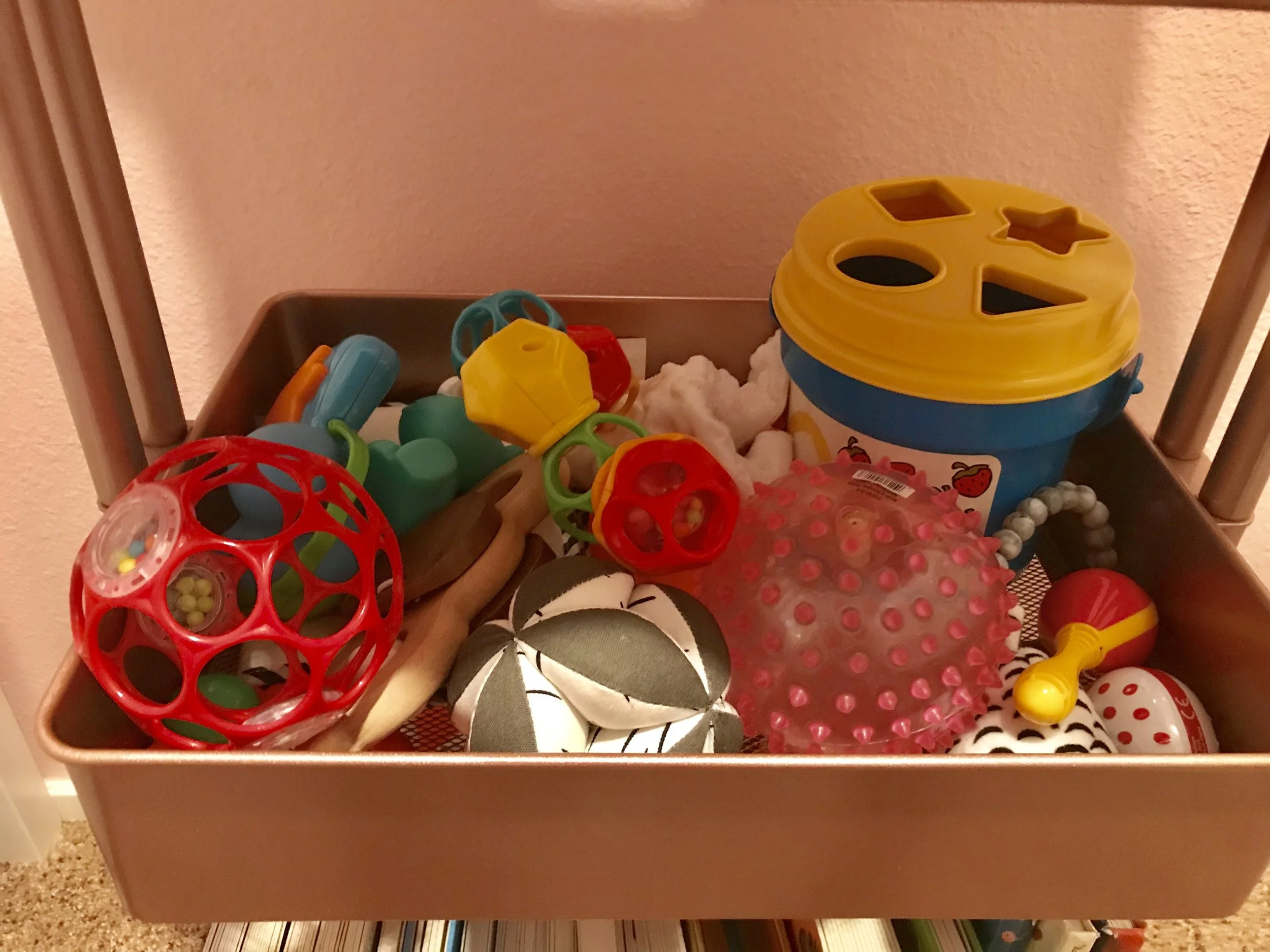 These toys were right at her eye hight when she was sitting down so she could grab them.