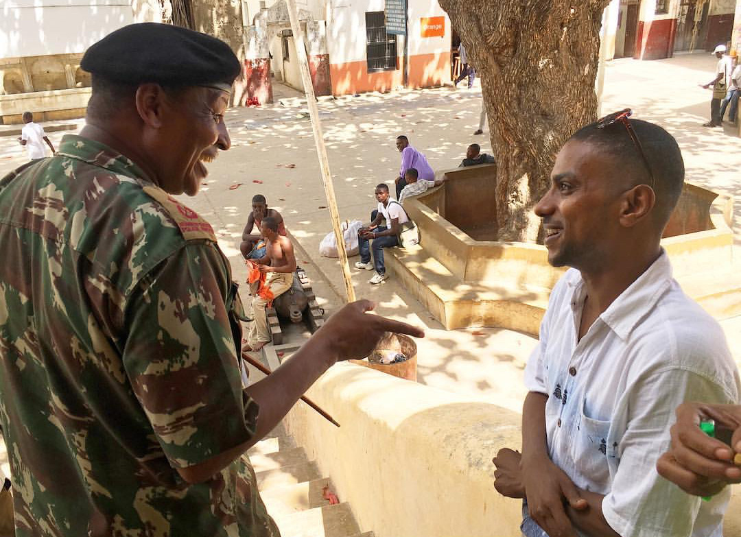 A Kenyan police commander discusses policing practices with a young man in Lamu County – another hotspot in Kenya’s war with al-Shabaab. Photo: Margot Kiser