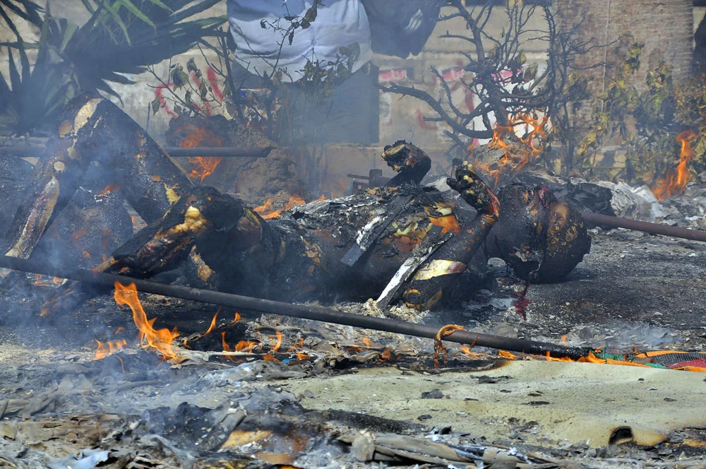 A burnt corpse near Nahda square, August 2013. Photo: Engy Imad/AFP/Getty Images
