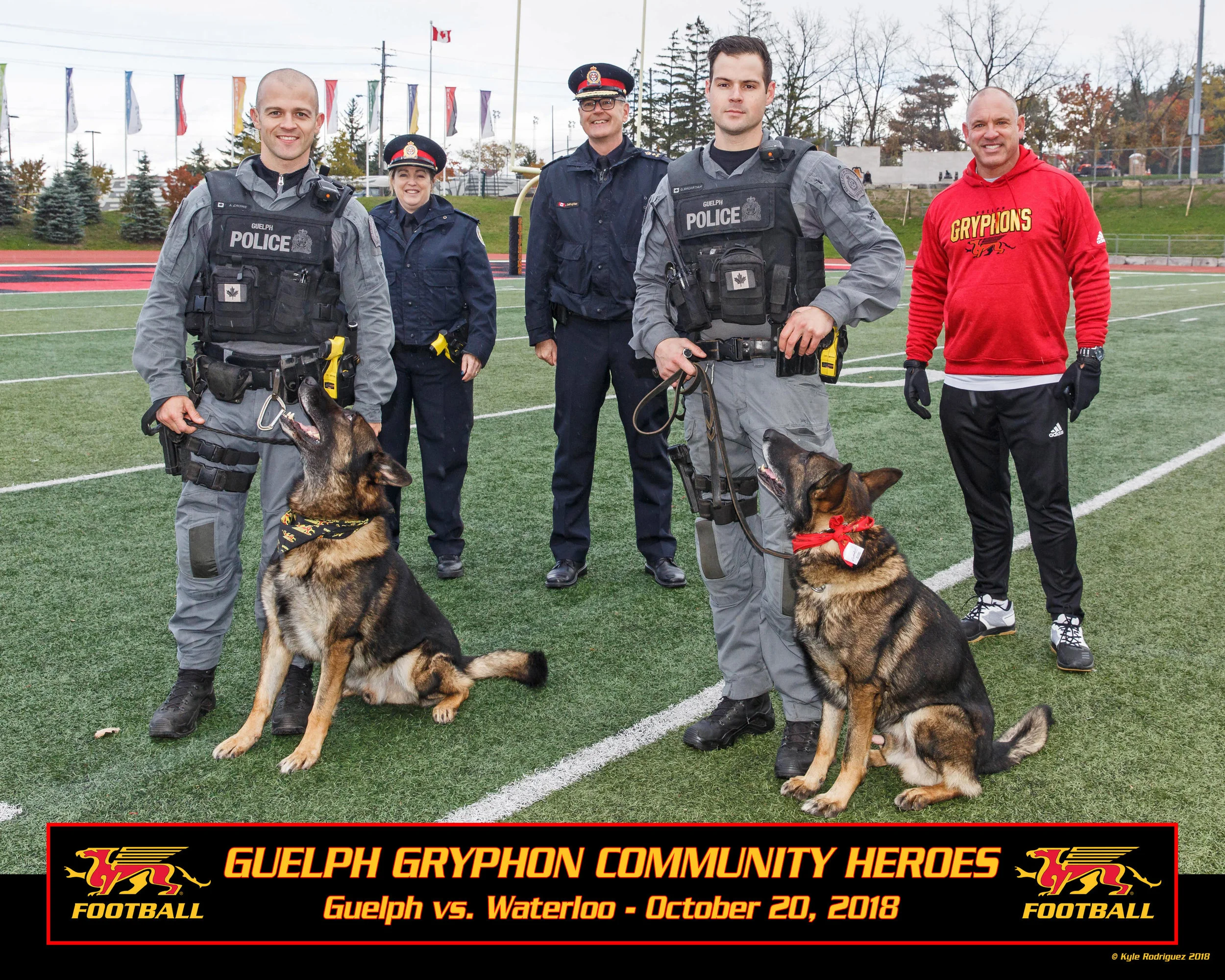 Left to right front: Cst. Andrew Crowe and Police Service Dog Charger, Cst. Greg McArthur and Police Service Dog General Left to right rear: Inspector Andrea Ninacs, Chief Jeff DeRuyter, Doug Pflug (Gryphon Football)