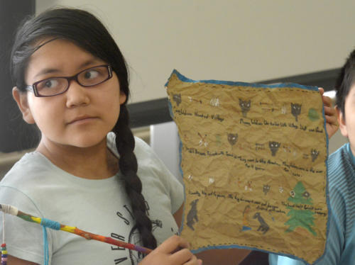 Sheiyann Thomas, 12, shares her story and art she made during the summer program’s storytelling class. Greg Sorber //Albuquerque Journal.