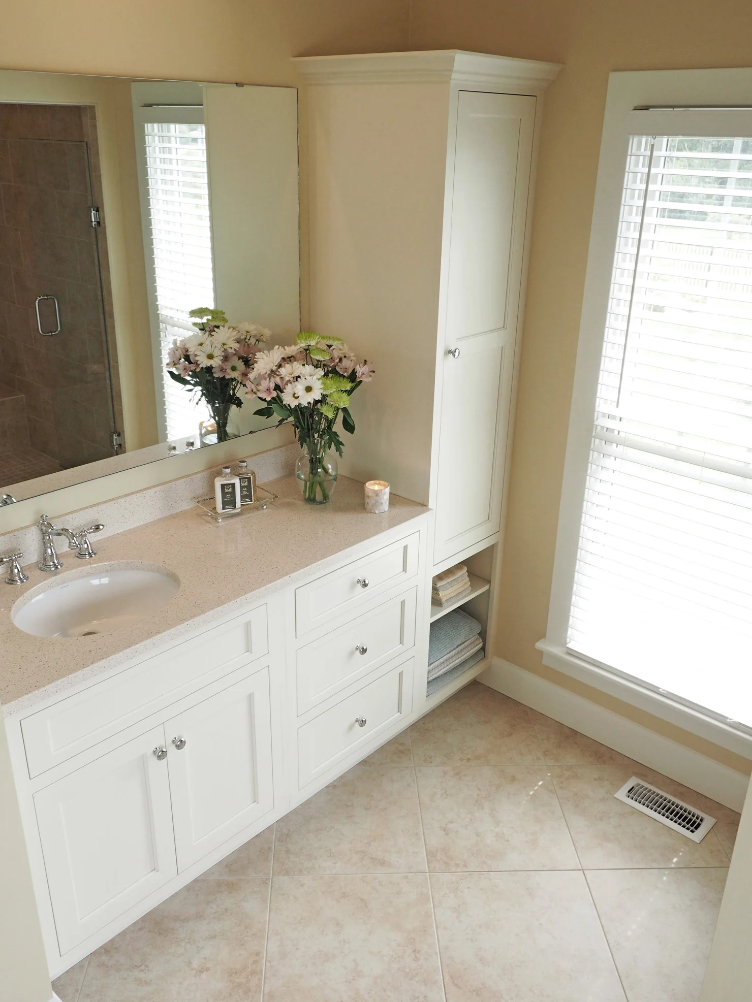 Previous paint color was Ivoire by Sherwin Williams. Our counter tops are Cambria Quartz and the name is Cardiff Cream.